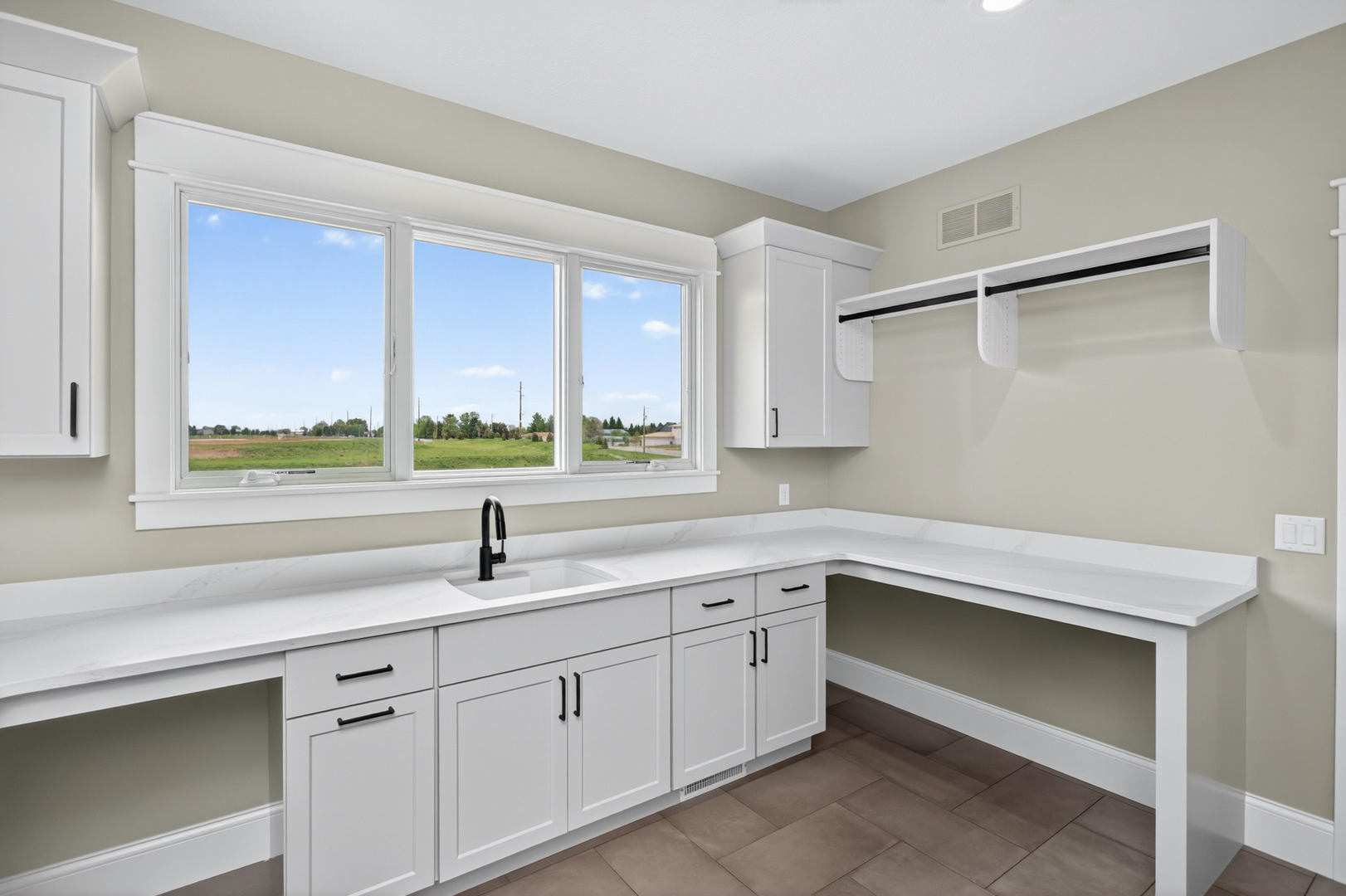 6928 Wilderness Pointe Bettendorf, IA 52722 - Photo 28 of 48 a kitchen with a sink and cabinets