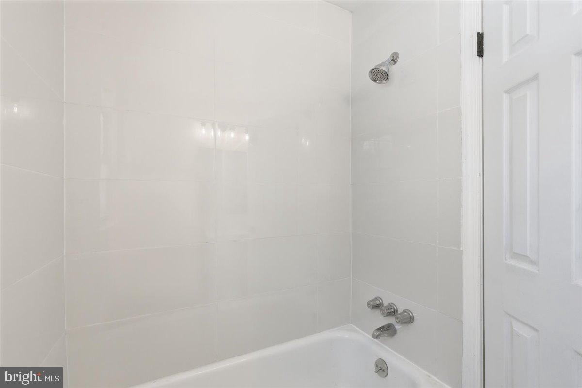 9704 Lorain Avenue Silver Spring, MD 20901 - Photo 13 of 26 a bathroom with a bathtub