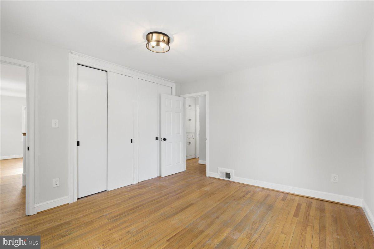 9704 Lorain Avenue Silver Spring, MD 20901 - Photo 17 of 26 a view of a room with wooden floor
