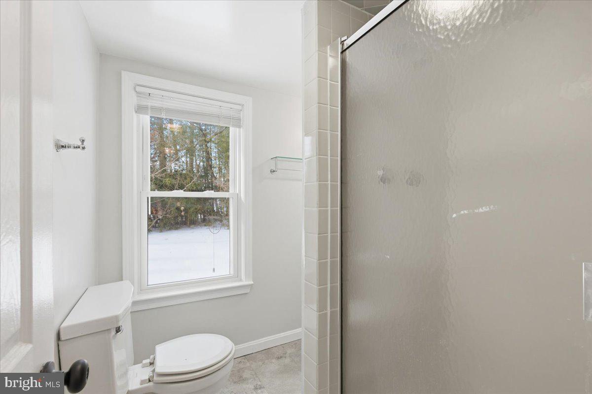 9704 Lorain Avenue Silver Spring, MD 20901 - Photo 20 of 26 a white toilet sitting next to a bathroom sink