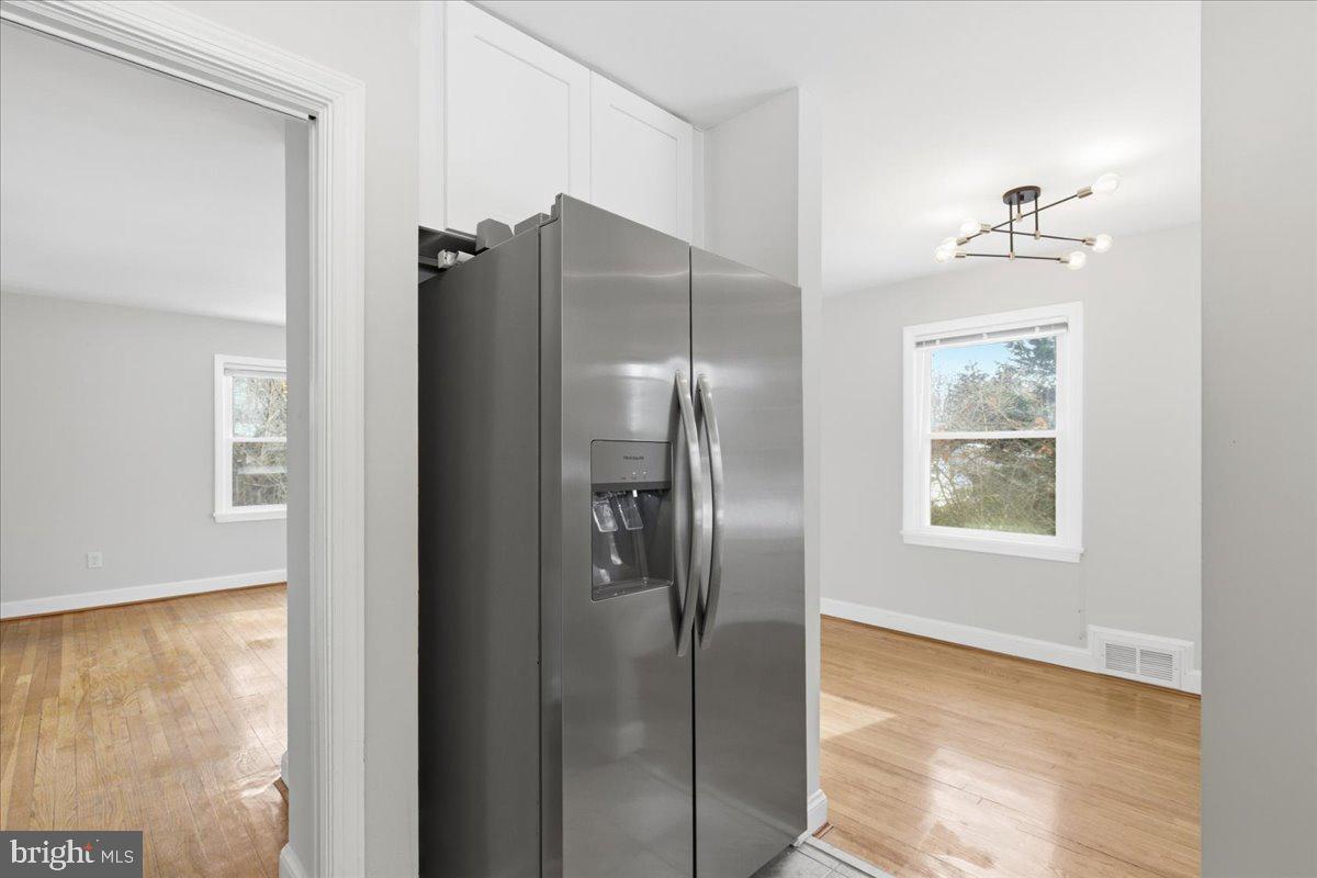 9704 Lorain Avenue Silver Spring, MD 20901 - Photo 9 of 26 a view of a refrigerator in kitchen and a window