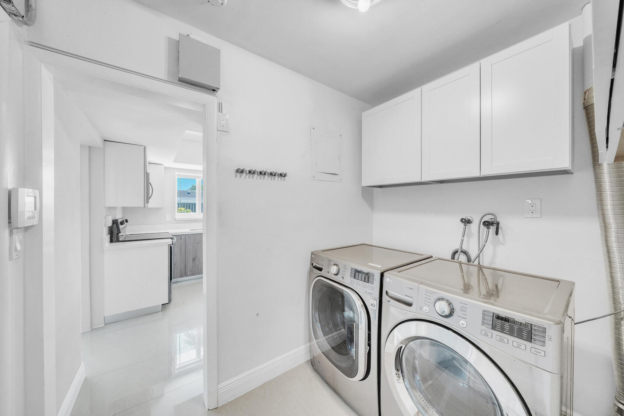 1970 Northeast 32nd Street Lighthouse Point, FL 33064 - Photo 38 of 58 11 Laundry Room