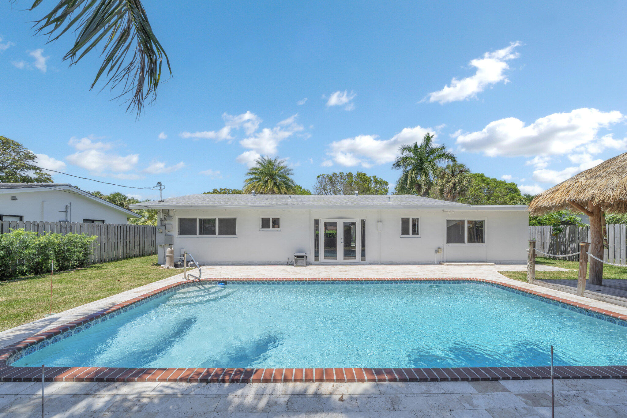 1970 Northeast 32nd Street Lighthouse Point, FL 33064 - Photo 7 of 58 Pool and back of the house