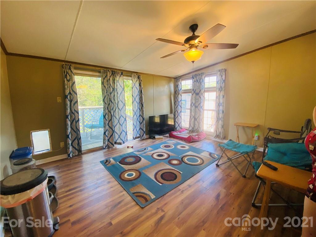 46 Austin Road Clyde, NC 28721 - Photo 11 of 20 a bedroom with a bed and wooden floor