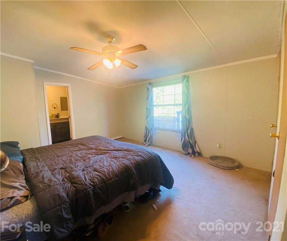46 Austin Road Clyde, NC 28721 - Photo 12 of 20 a bedroom with a bed and a window