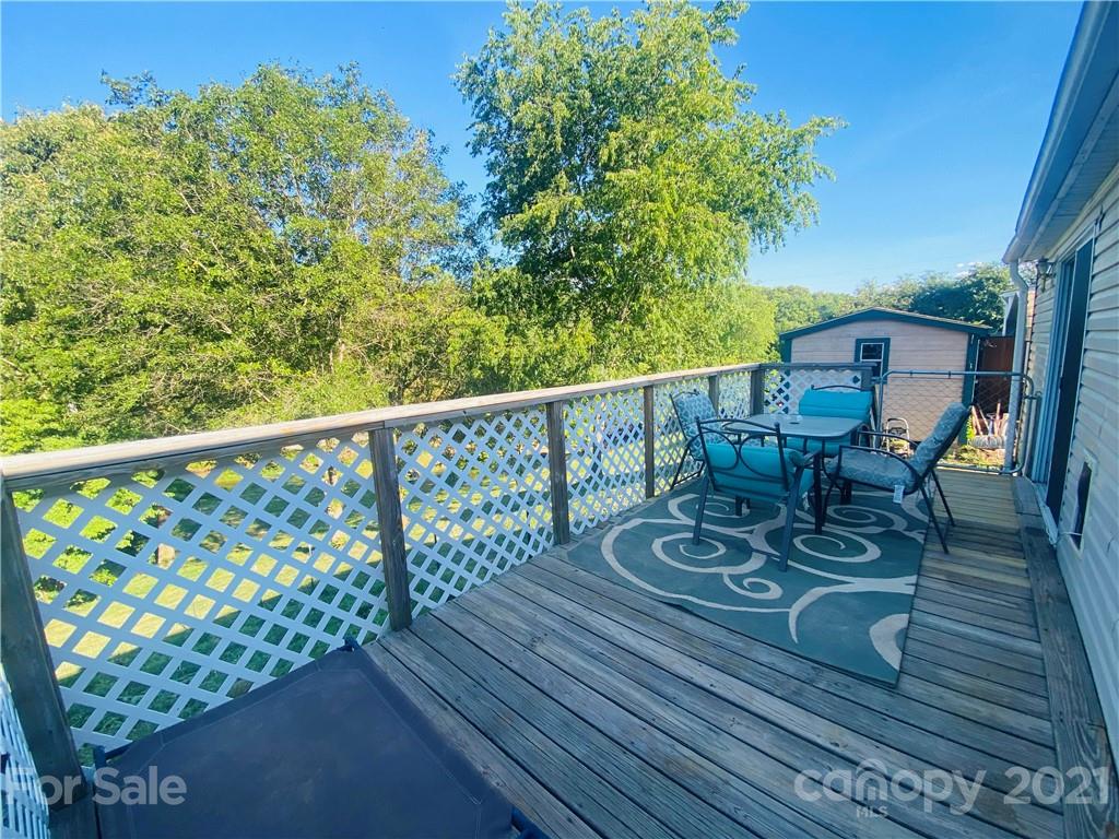 46 Austin Road Clyde, NC 28721 - Photo 5 of 20 a view of a chairs and table on the wooden floor