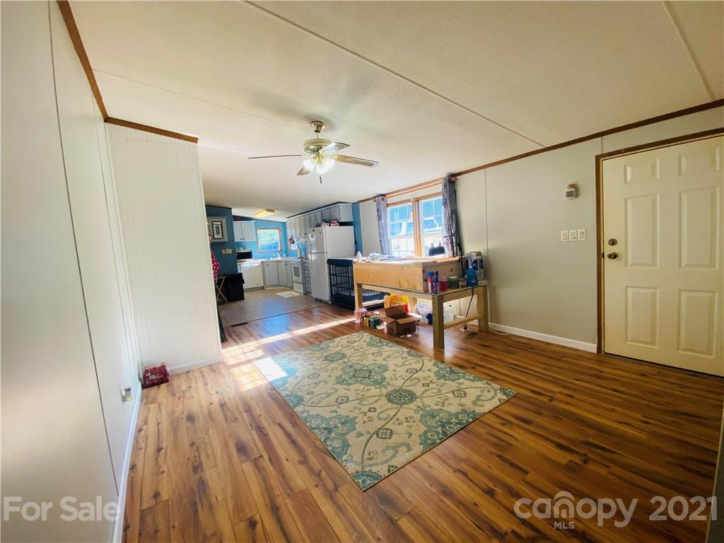 46 Austin Road Clyde, NC 28721 - Photo 10 of 20 a living room with furniture and a wooden floor