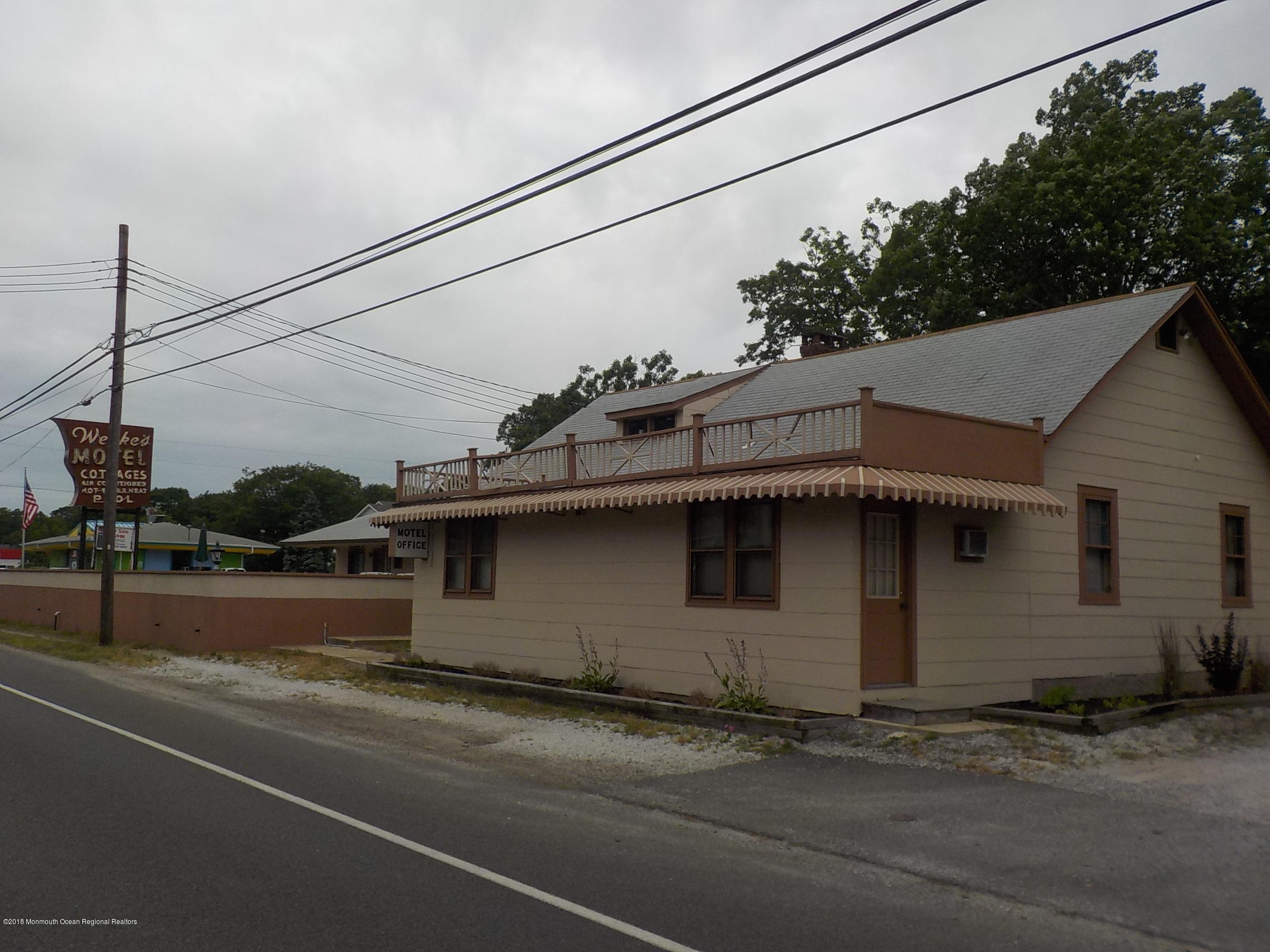 a view of a house with a street