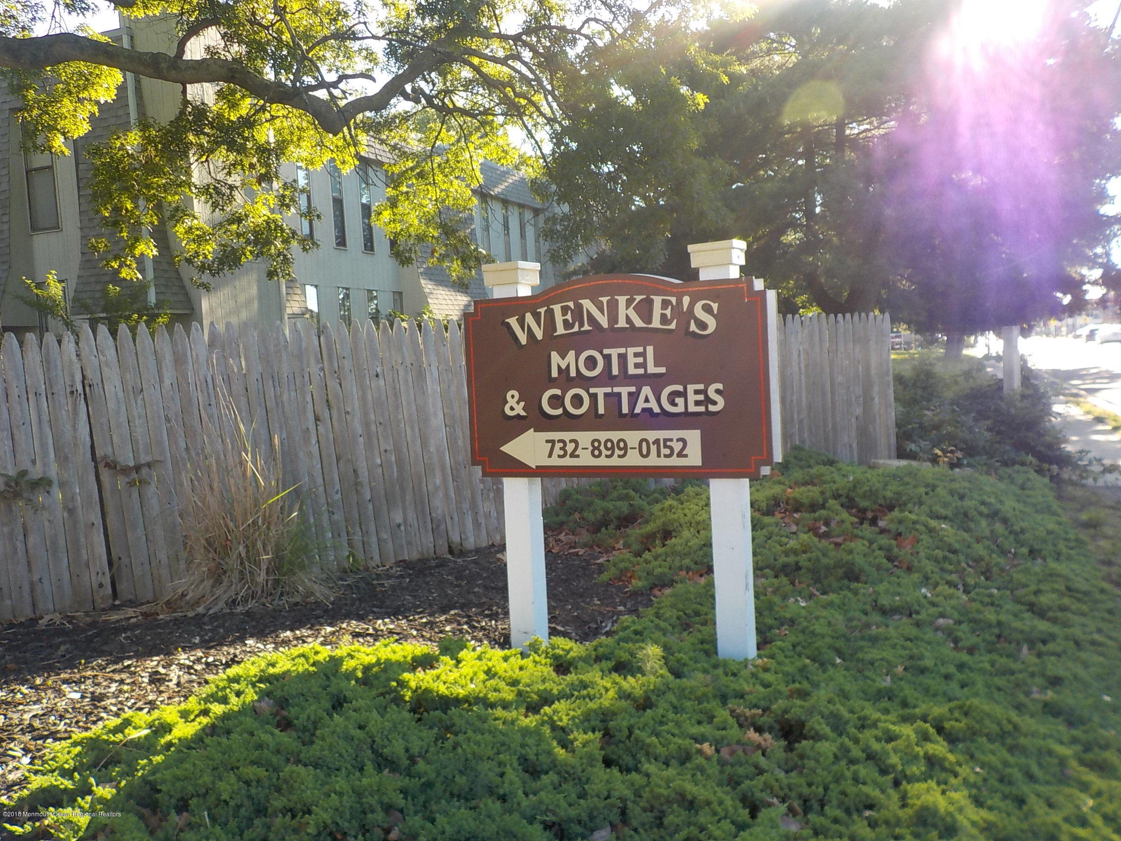2613 Route 88 Point Point Pleasant, NJ 08742 - Photo 11 of 14 a sign that is sitting in front of flowers