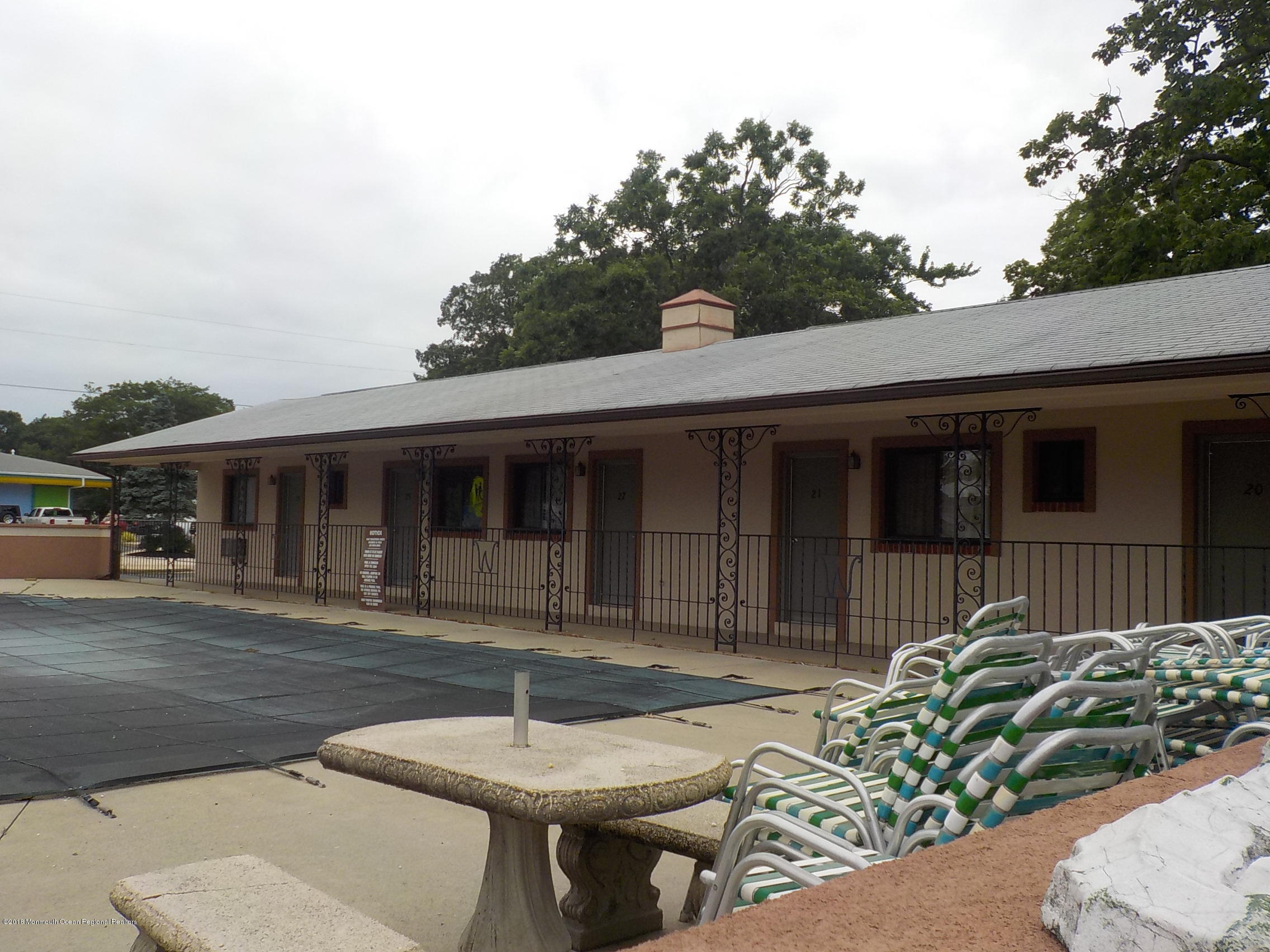 2613 Route 88 Point Point Pleasant, NJ 08742 - Photo 14 of 14 a backyard of a house with table and chairs