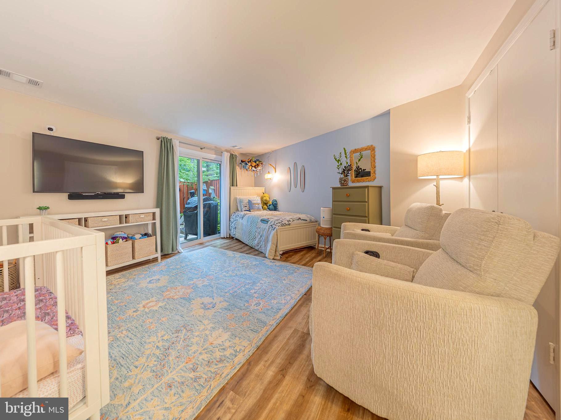 11287 Silentwood Lane Reston, VA 20191 - Photo 5 of 21 Lower level bedroom exits to back patio