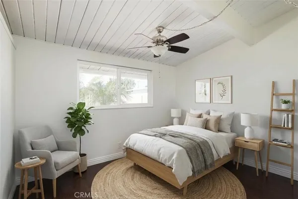 a bedroom with a bed and furniture