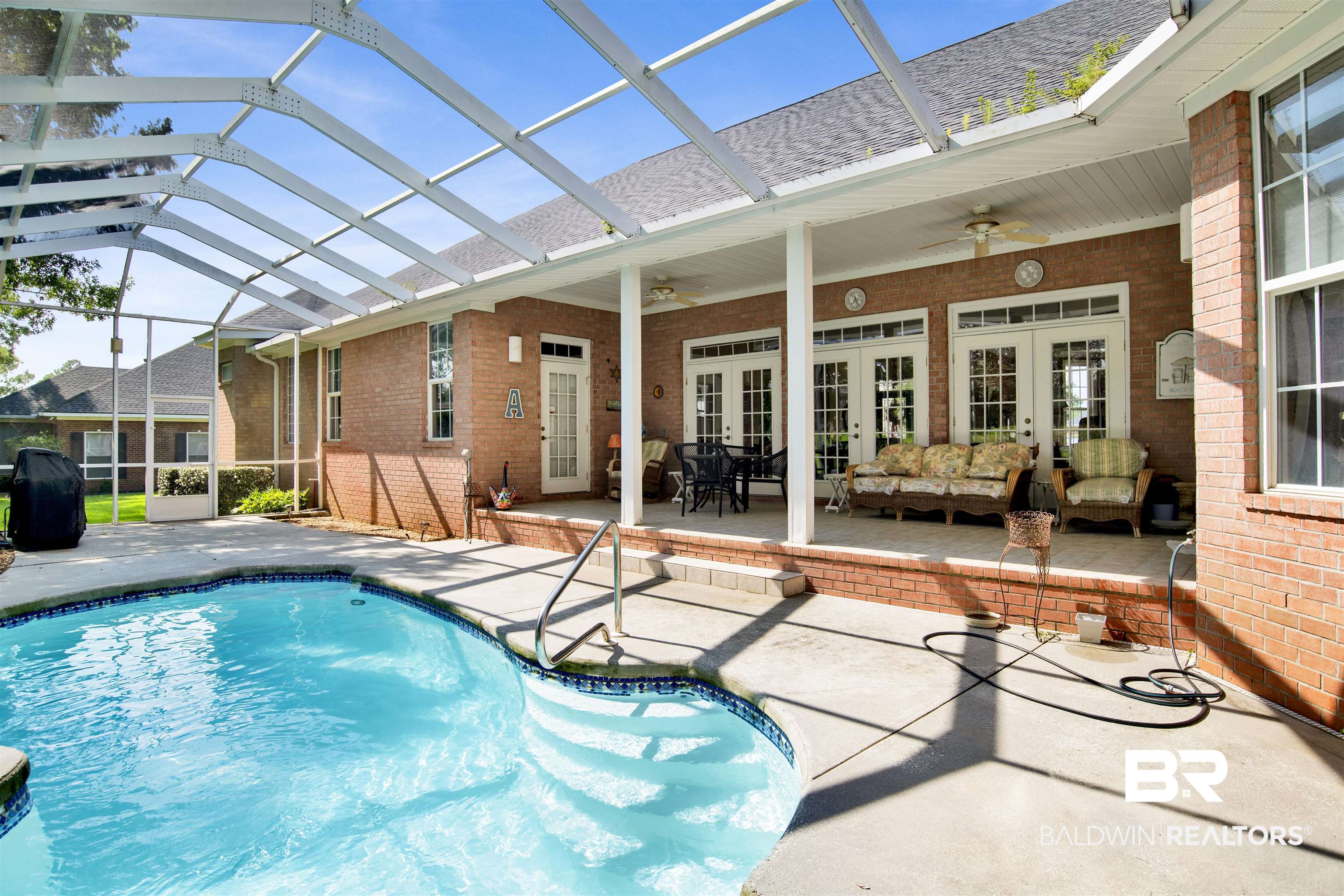23014 Carnoustie Drive Foley, AL 36535 - Photo 41 of 49 Swimming pool with a patio area, french doors, a lanai, and a ceiling fan