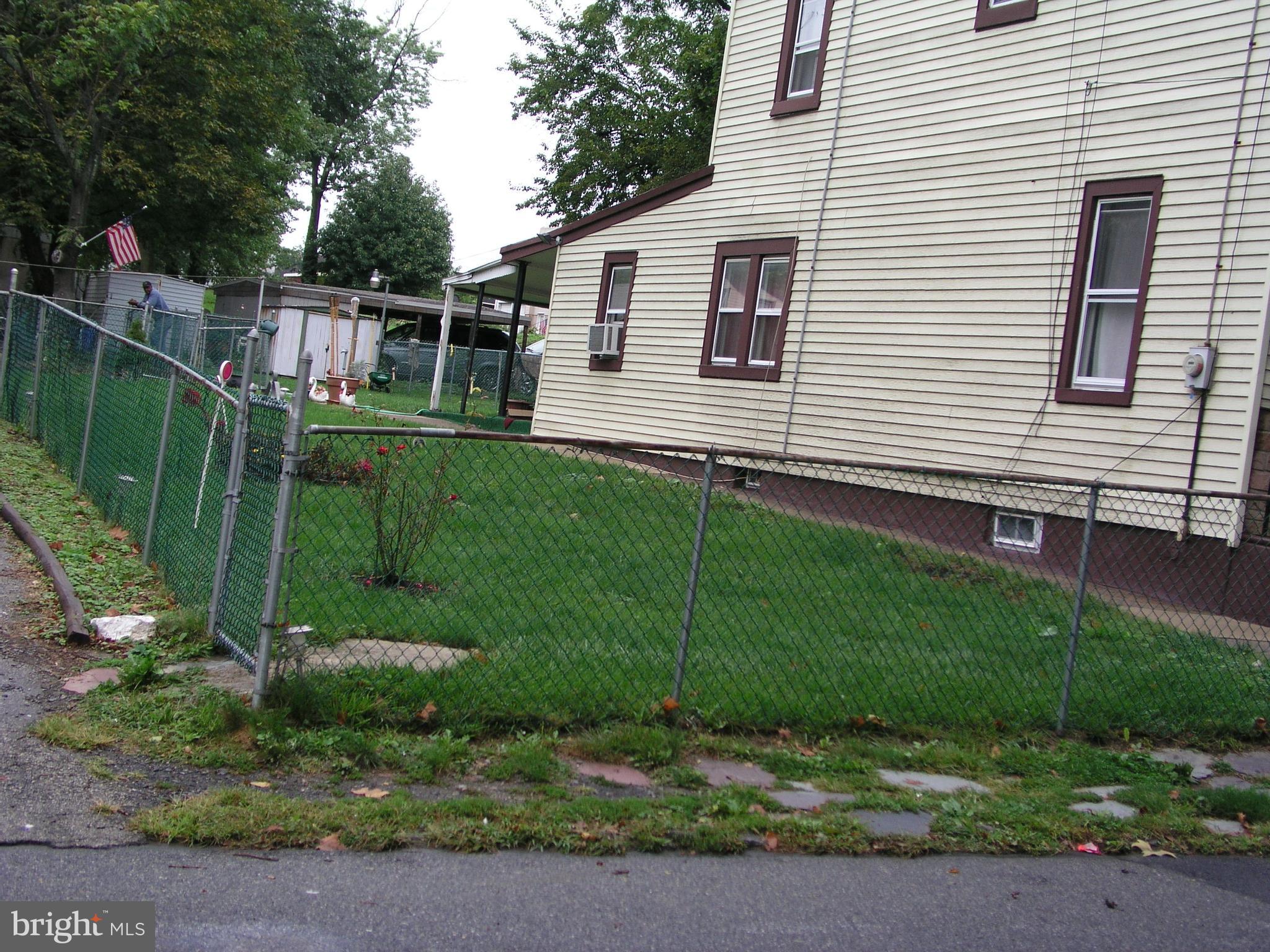 4128 Welsh Road Philadelphia, PA 19136 - Photo 1 of 2 a backyard of a house with lots of green space