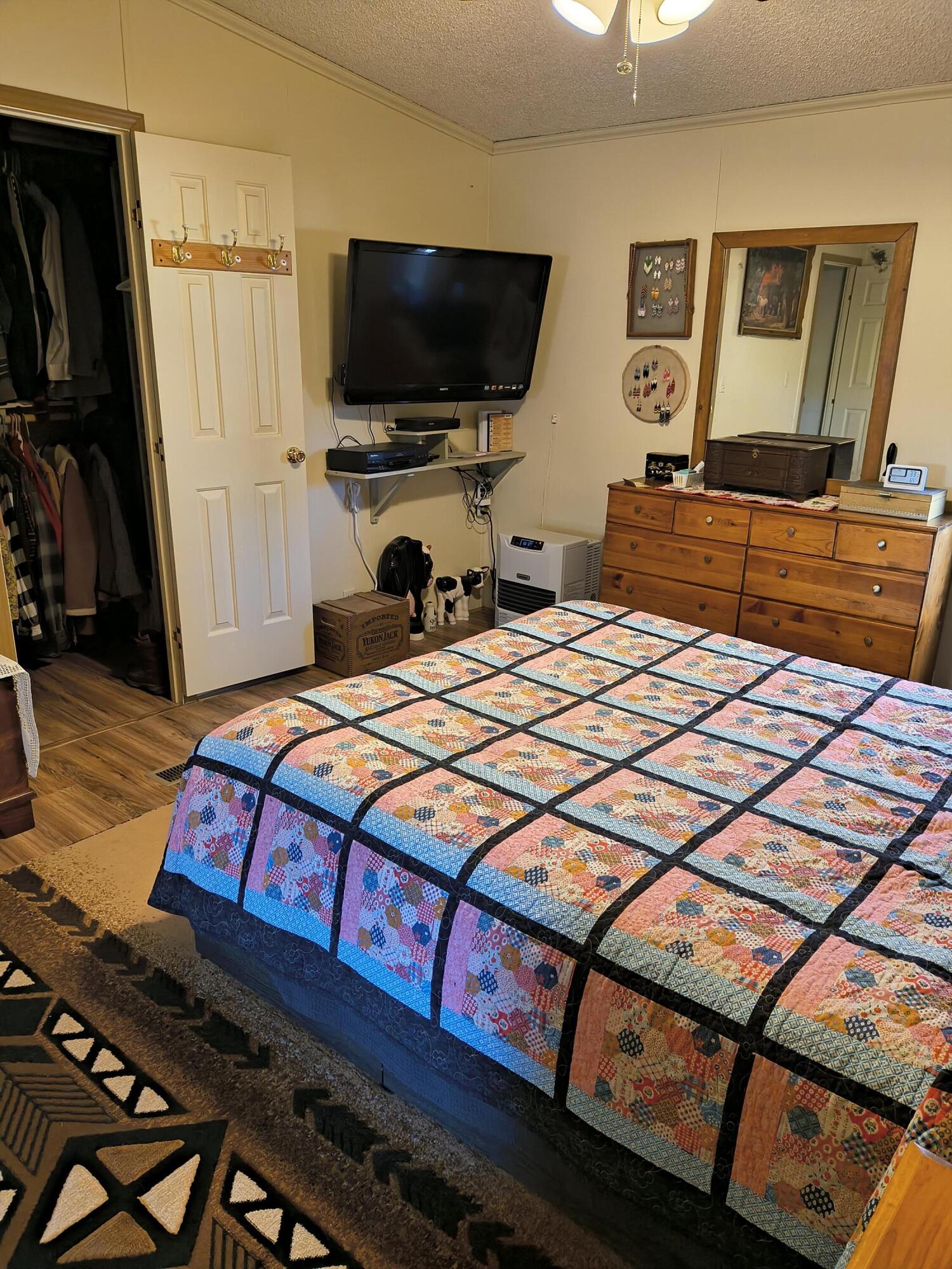 235 North Roosevelt Street Merrill, OR 97633 - Photo 23 of 27 a bedroom with a bed and a flat screen tv