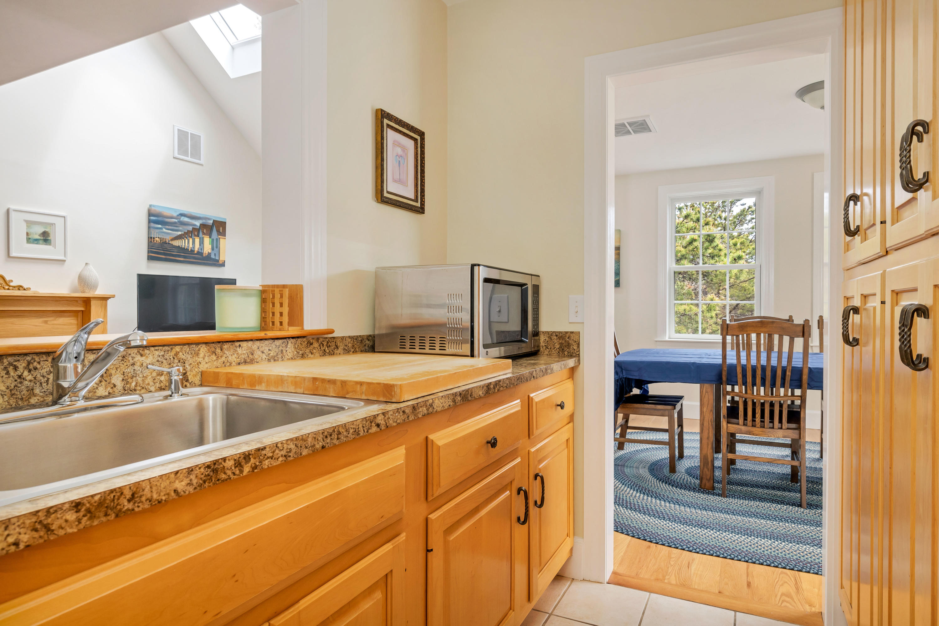 39 South Highland Road Truro, MA 02666 - Photo 12 of 46 a kitchen with a sink and a refrigerator