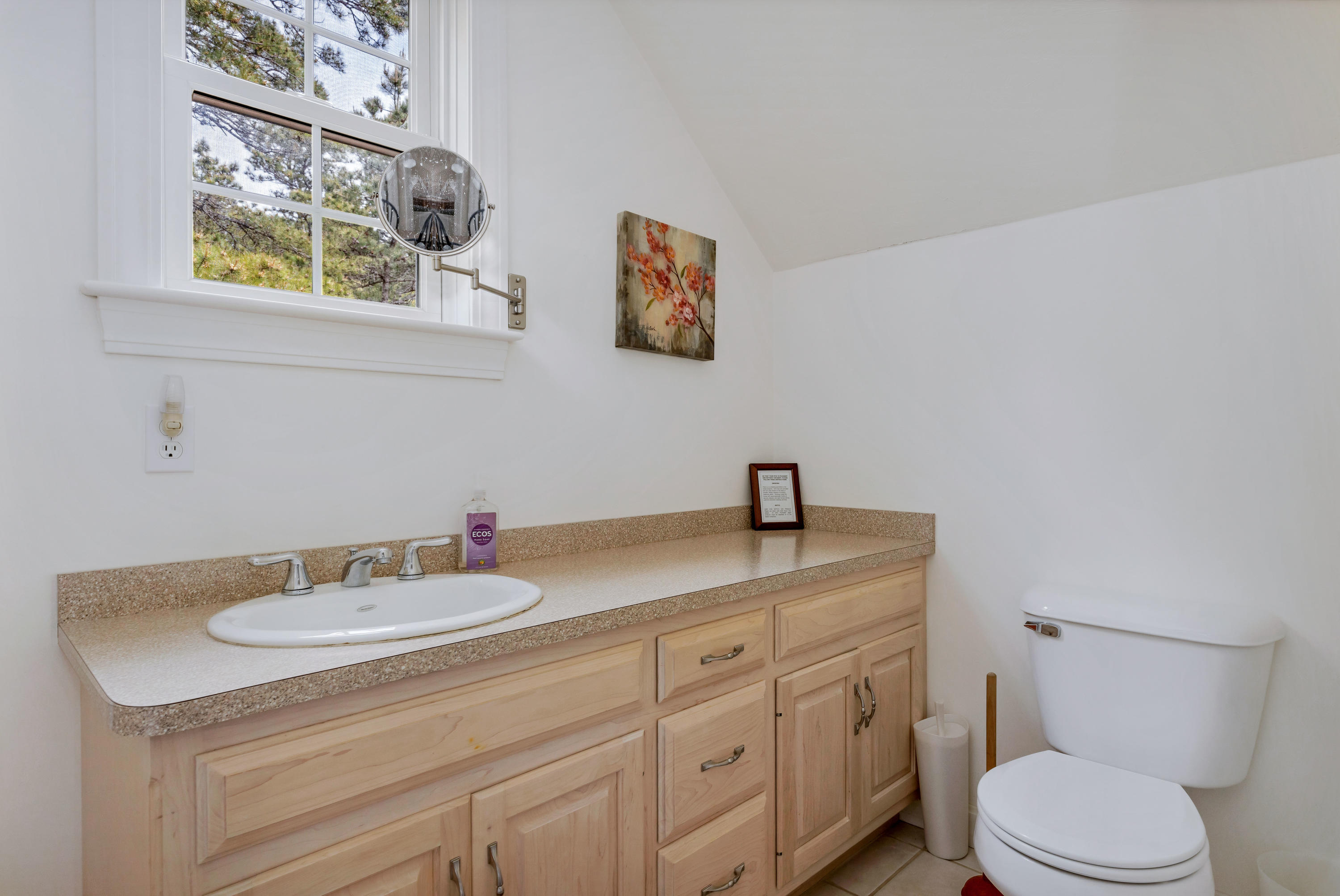 39 South Highland Road Truro, MA 02666 - Photo 29 of 46 a bathroom with a granite countertop sink toilet and a mirror