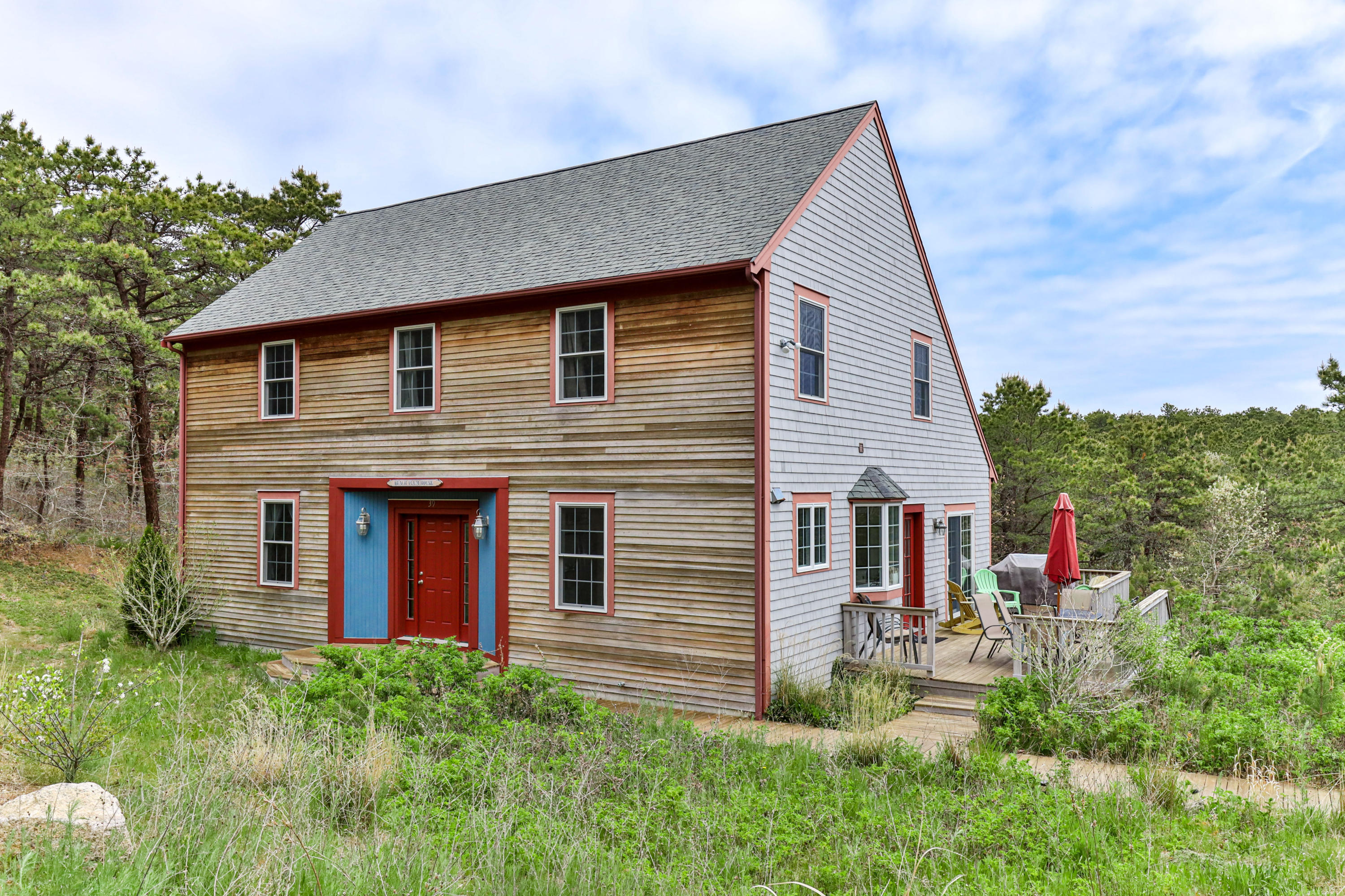 39 South Highland Road Truro, MA 02666 - Photo 3 of 46 a front view of a house with a porch