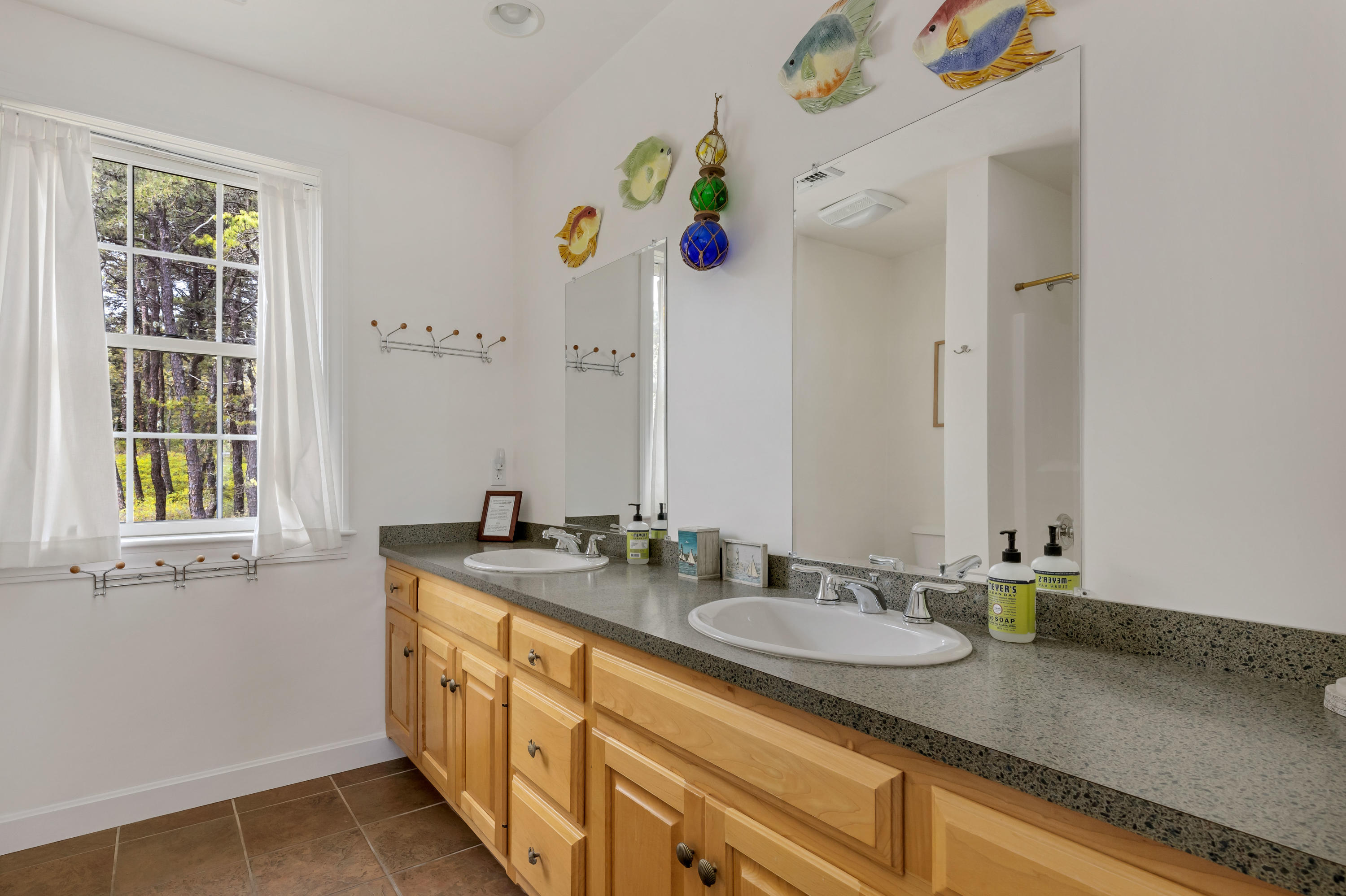 39 South Highland Road Truro, MA 02666 - Photo 33 of 46 a bathroom with a granite countertop sink and a mirror