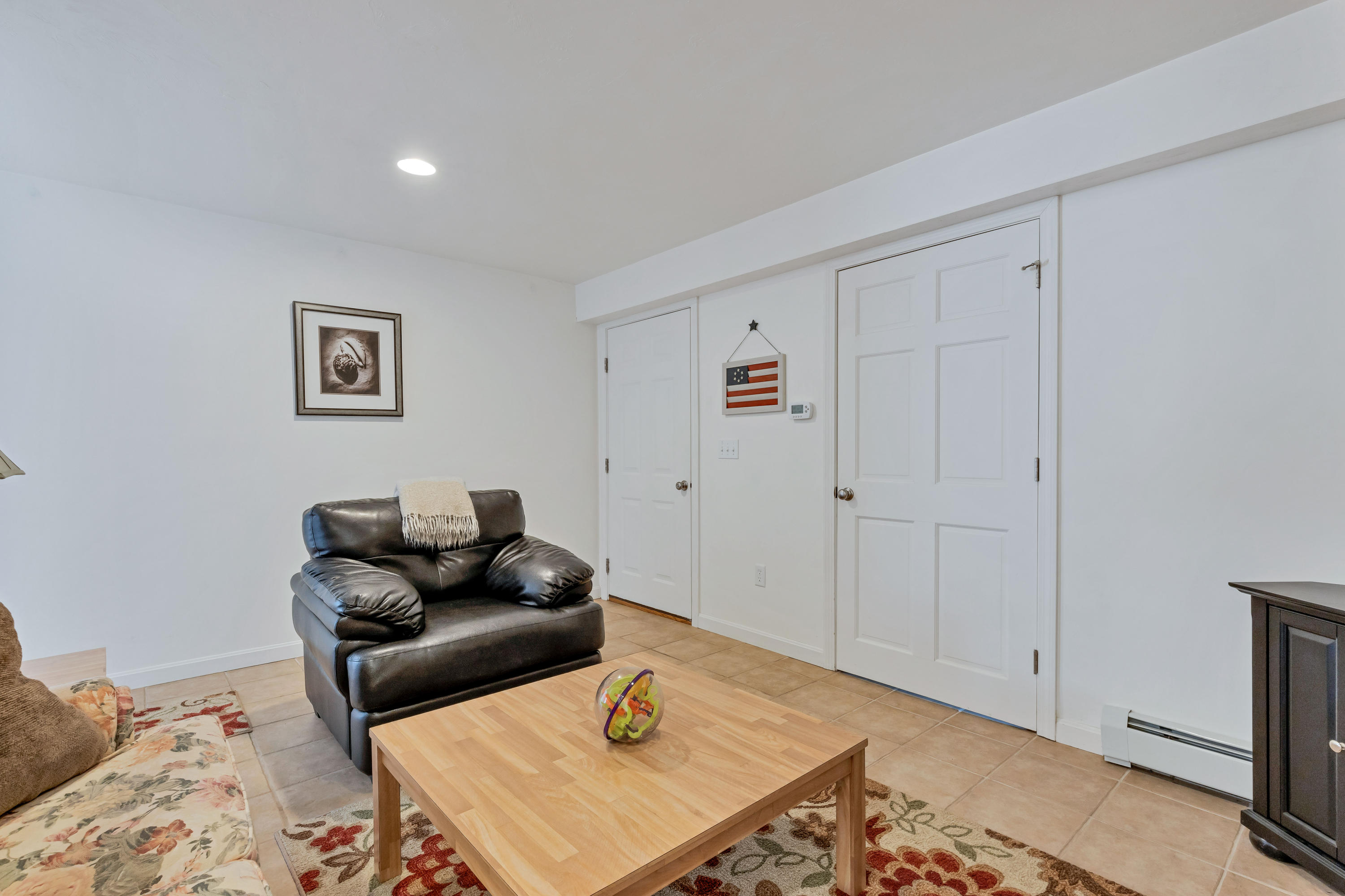 39 South Highland Road Truro, MA 02666 - Photo 36 of 46 a living room with furniture and a rug