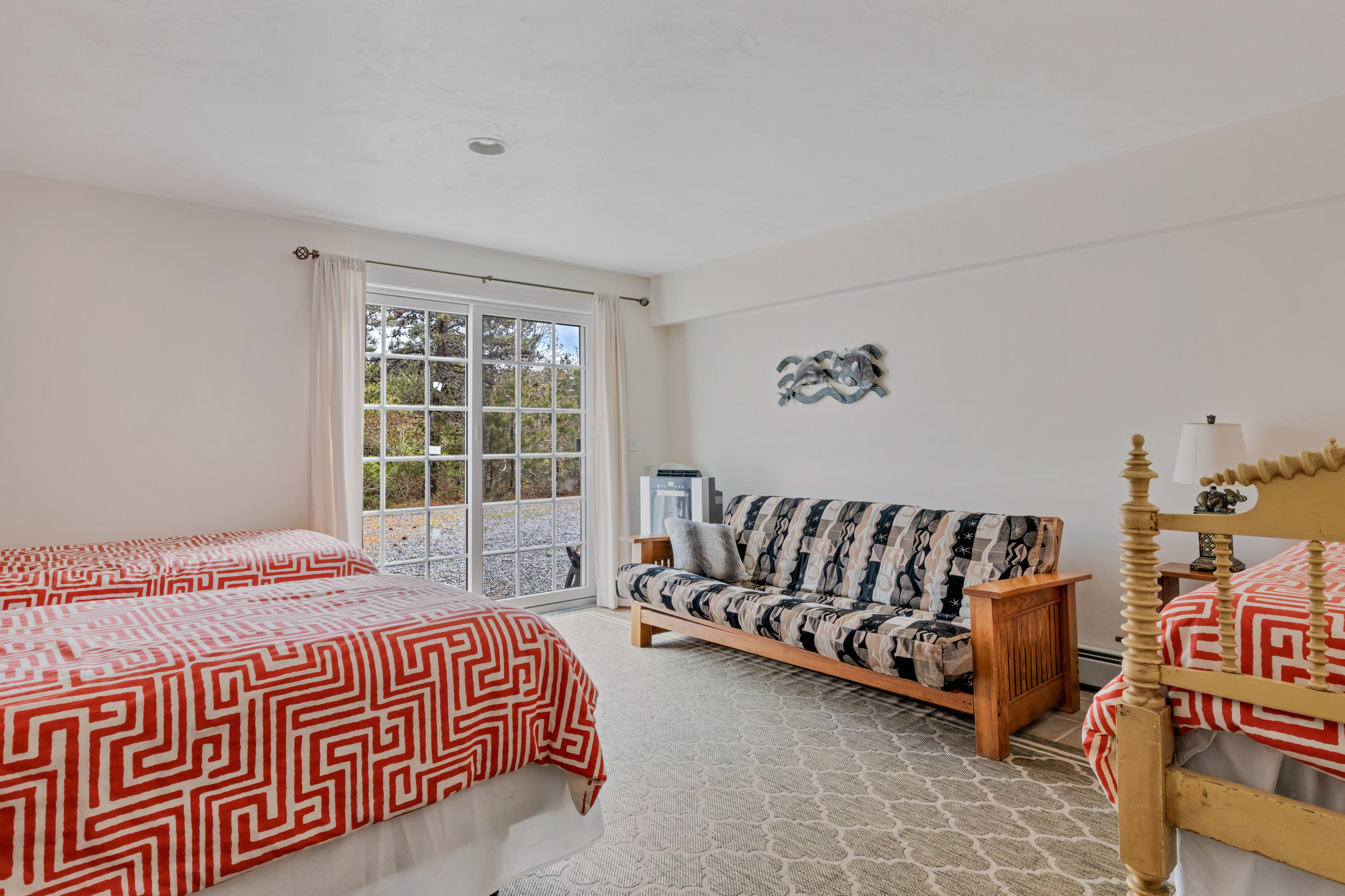 39 South Highland Road Truro, MA 02666 - Photo 38 of 46 a bedroom with a bed and a couch