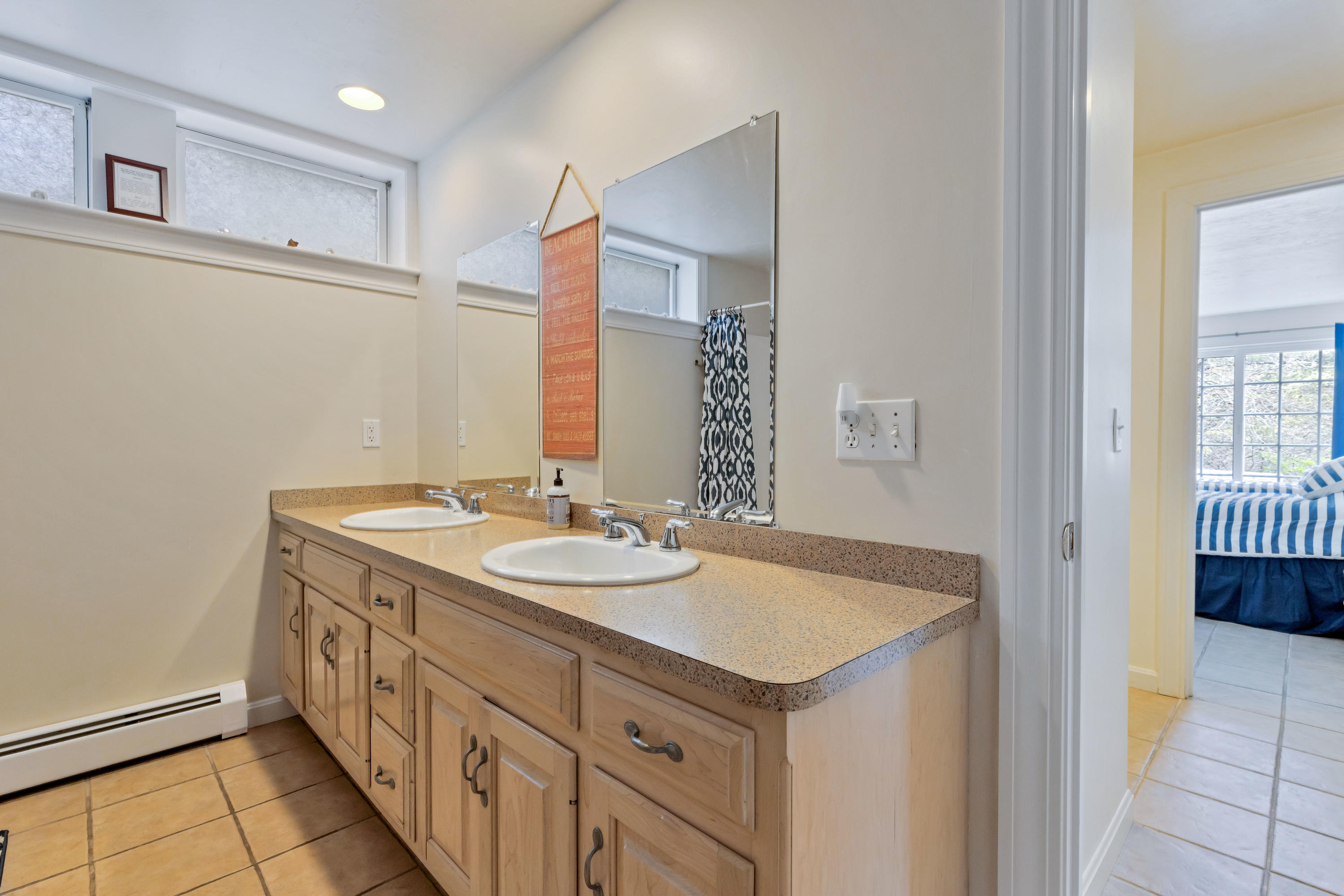 39 South Highland Road Truro, MA 02666 - Photo 40 of 46 a bathroom with a sink and a mirror