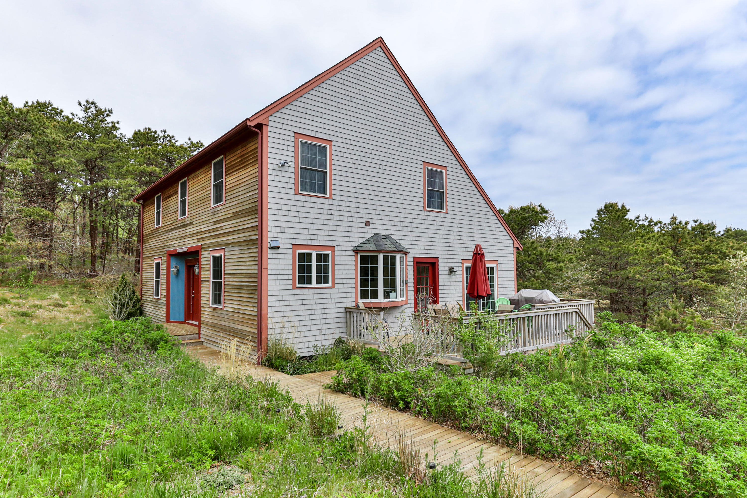 39 South Highland Road Truro, MA 02666 - Photo 4 of 46 a front view of house with yard and green space