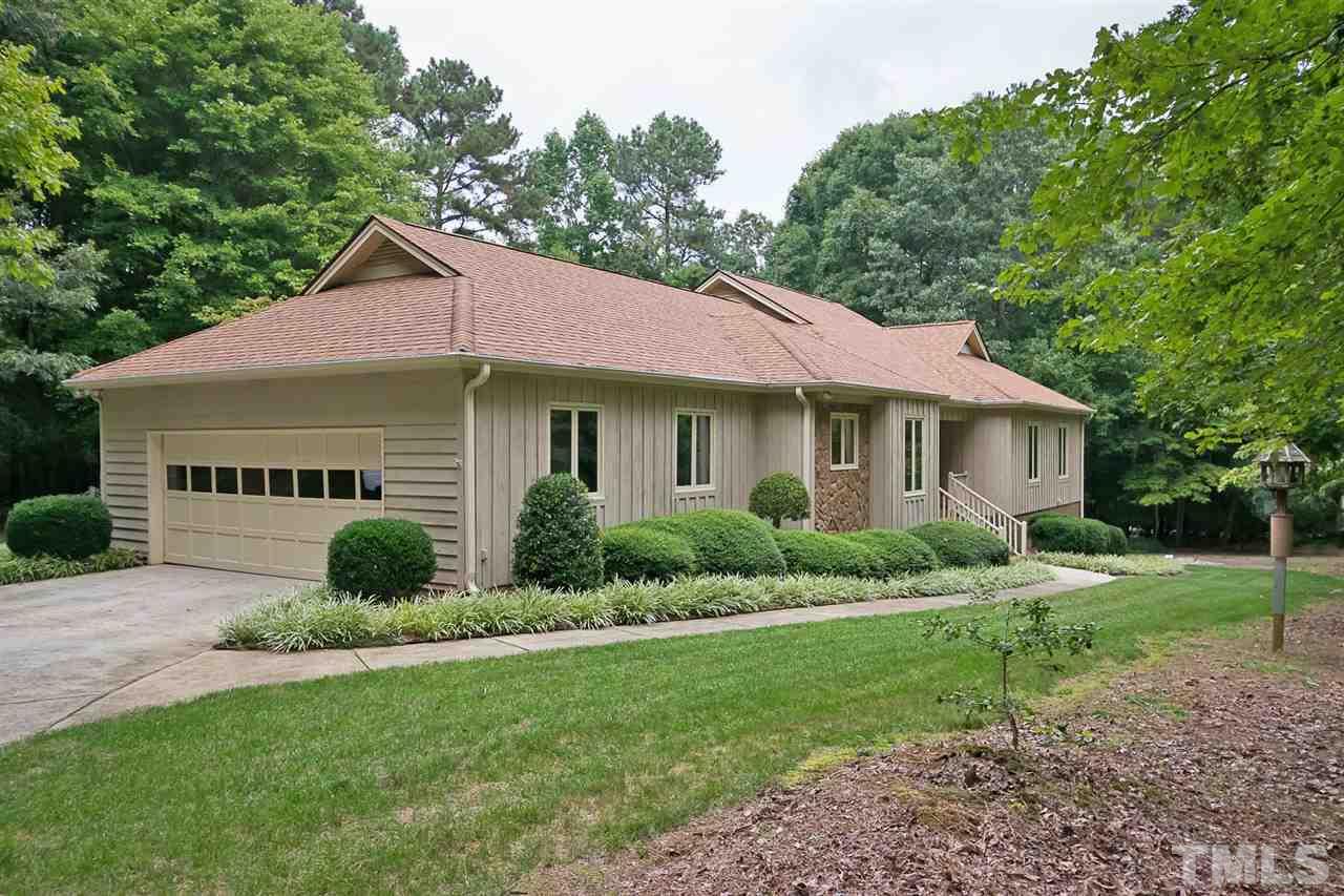 3020 Daventry Lane Raleigh, NC 27613 - Photo 1 of 25 a front view of a house with a yard