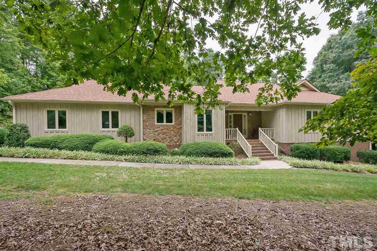 3020 Daventry Lane Raleigh, NC 27613 - Photo 2 of 25 a front view of a house with a yard and green space