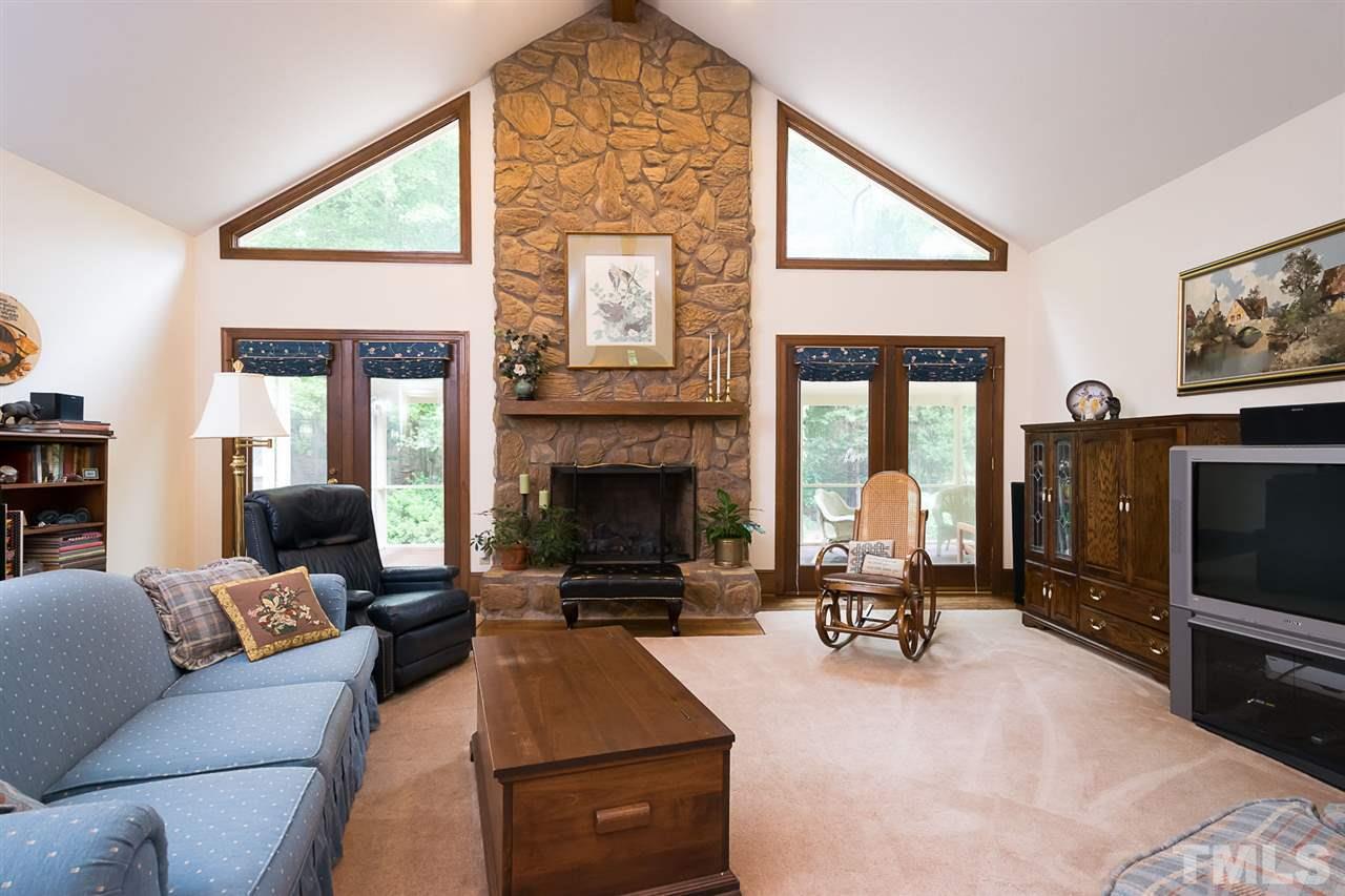 3020 Daventry Lane Raleigh, NC 27613 - Photo 11 of 25 a living room with furniture fireplace and flat screen tv
