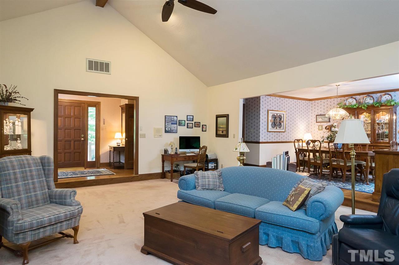 3020 Daventry Lane Raleigh, NC 27613 - Photo 12 of 25 a living room with furniture and a large window