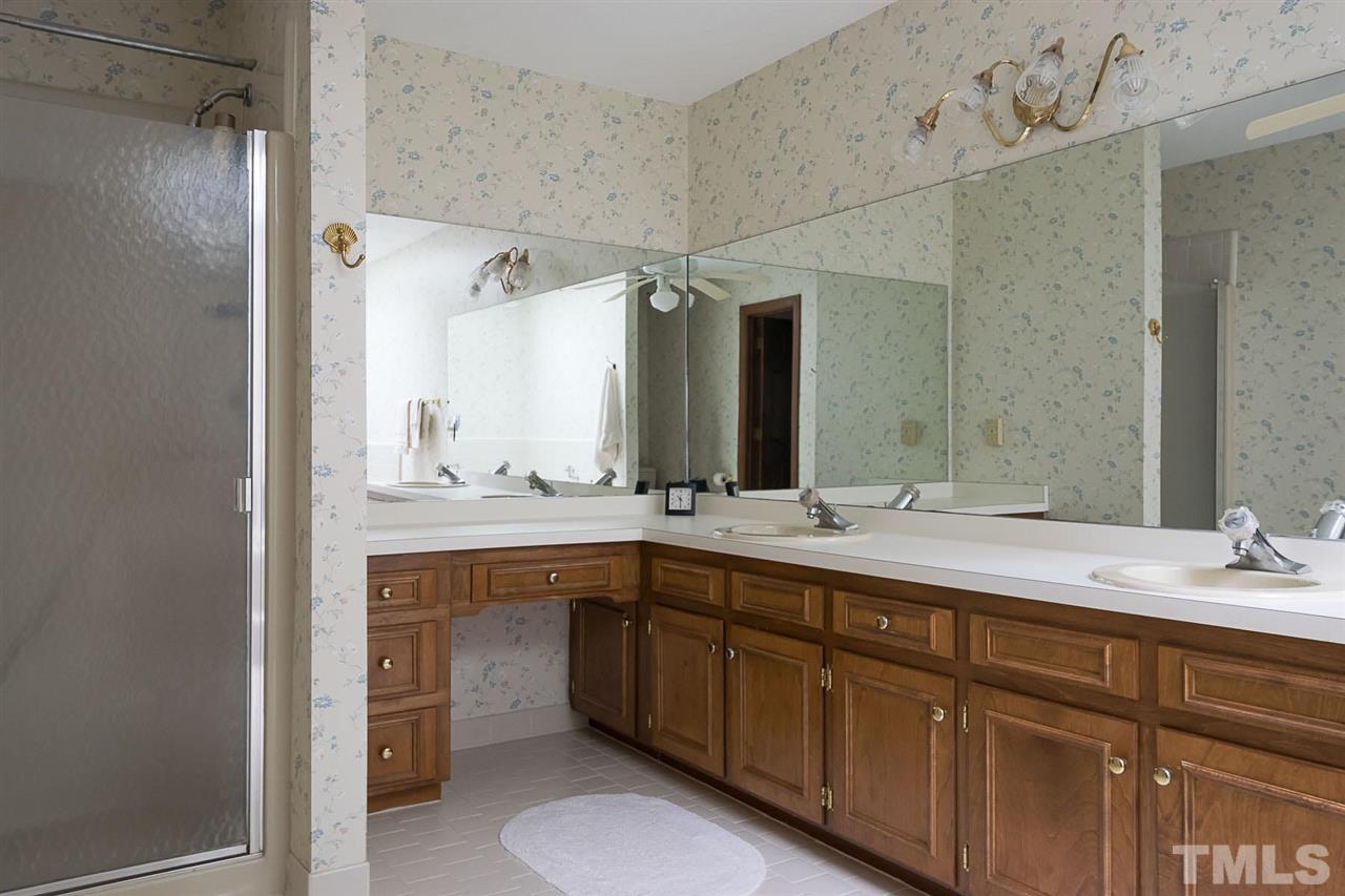 3020 Daventry Lane Raleigh, NC 27613 - Photo 15 of 25 a spacious bathroom with a double vanity sink mirror and double