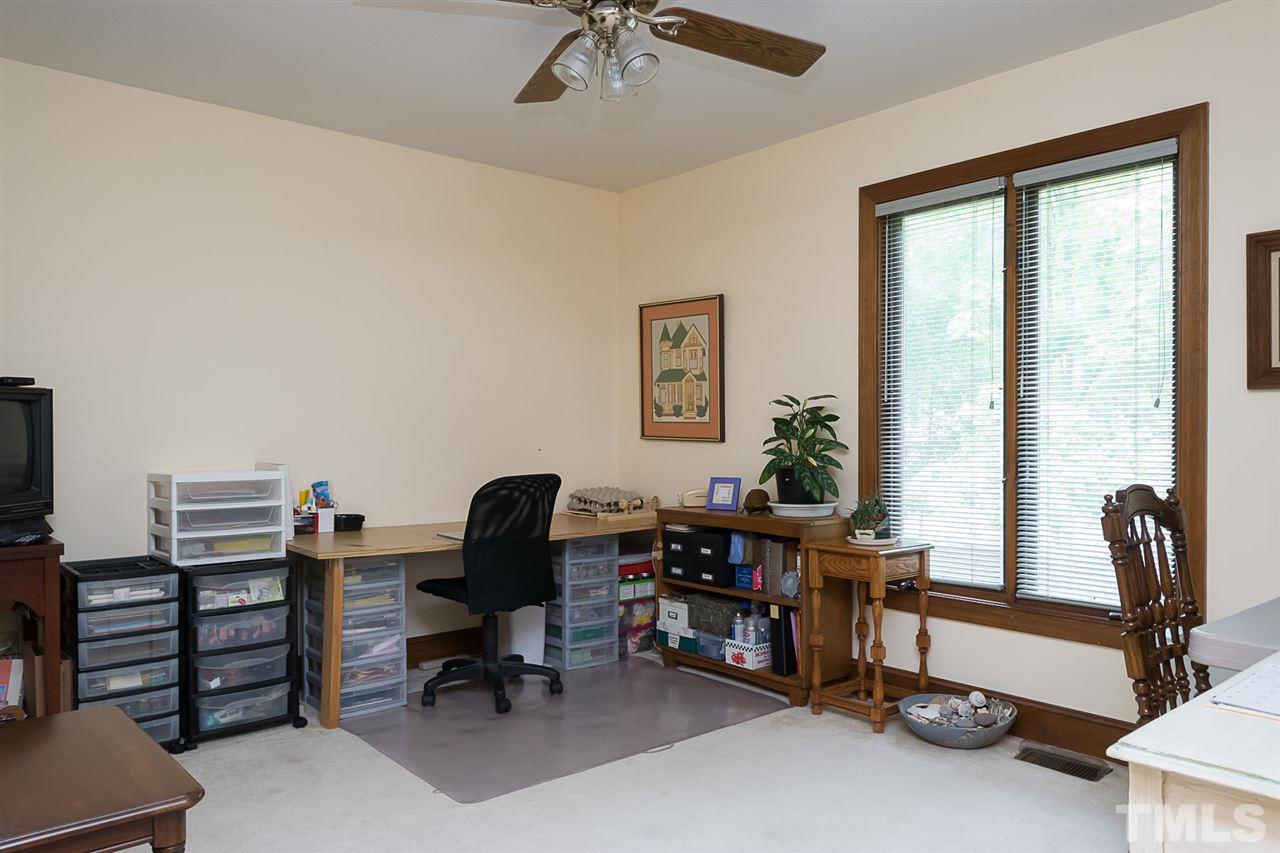 3020 Daventry Lane Raleigh, NC 27613 - Photo 16 of 25 a view of a workspace with furniture and a window