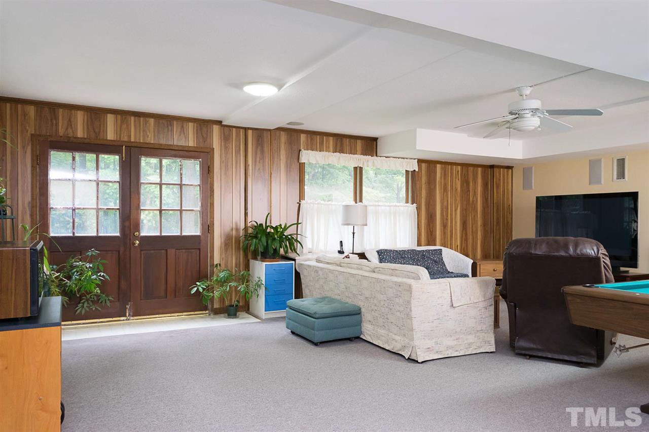 3020 Daventry Lane Raleigh, NC 27613 - Photo 21 of 25 a living room with furniture and a window