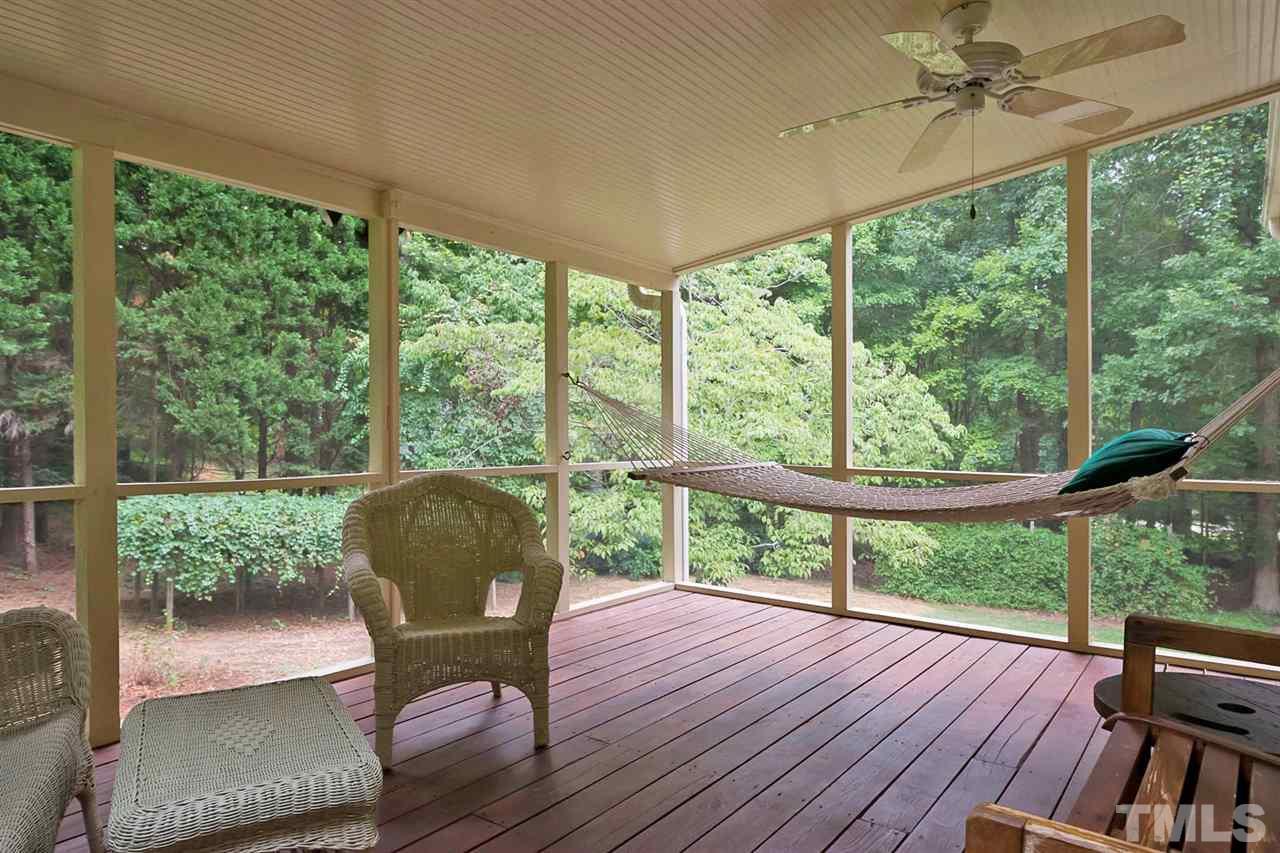 3020 Daventry Lane Raleigh, NC 27613 - Photo 23 of 25 a view of a porch with furniture and wooden floor