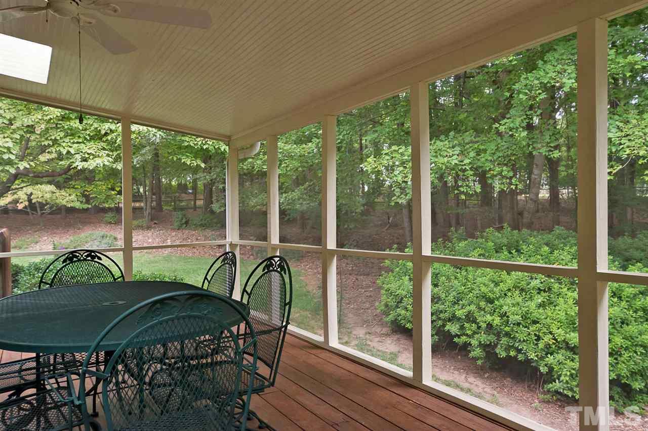 3020 Daventry Lane Raleigh, NC 27613 - Photo 24 of 25 a view of a chairs and table in patio with a yard