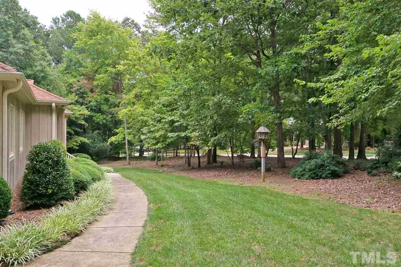 3020 Daventry Lane Raleigh, NC 27613 - Photo 4 of 25 a view of a backyard with a garden
