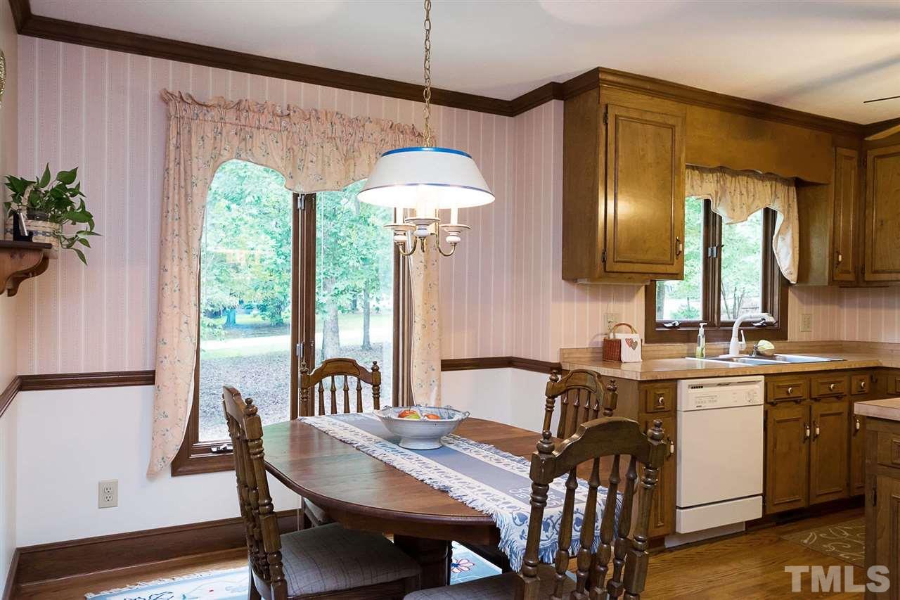 3020 Daventry Lane Raleigh, NC 27613 - Photo 5 of 25 a view of a a dining room with furniture window and wooden floor