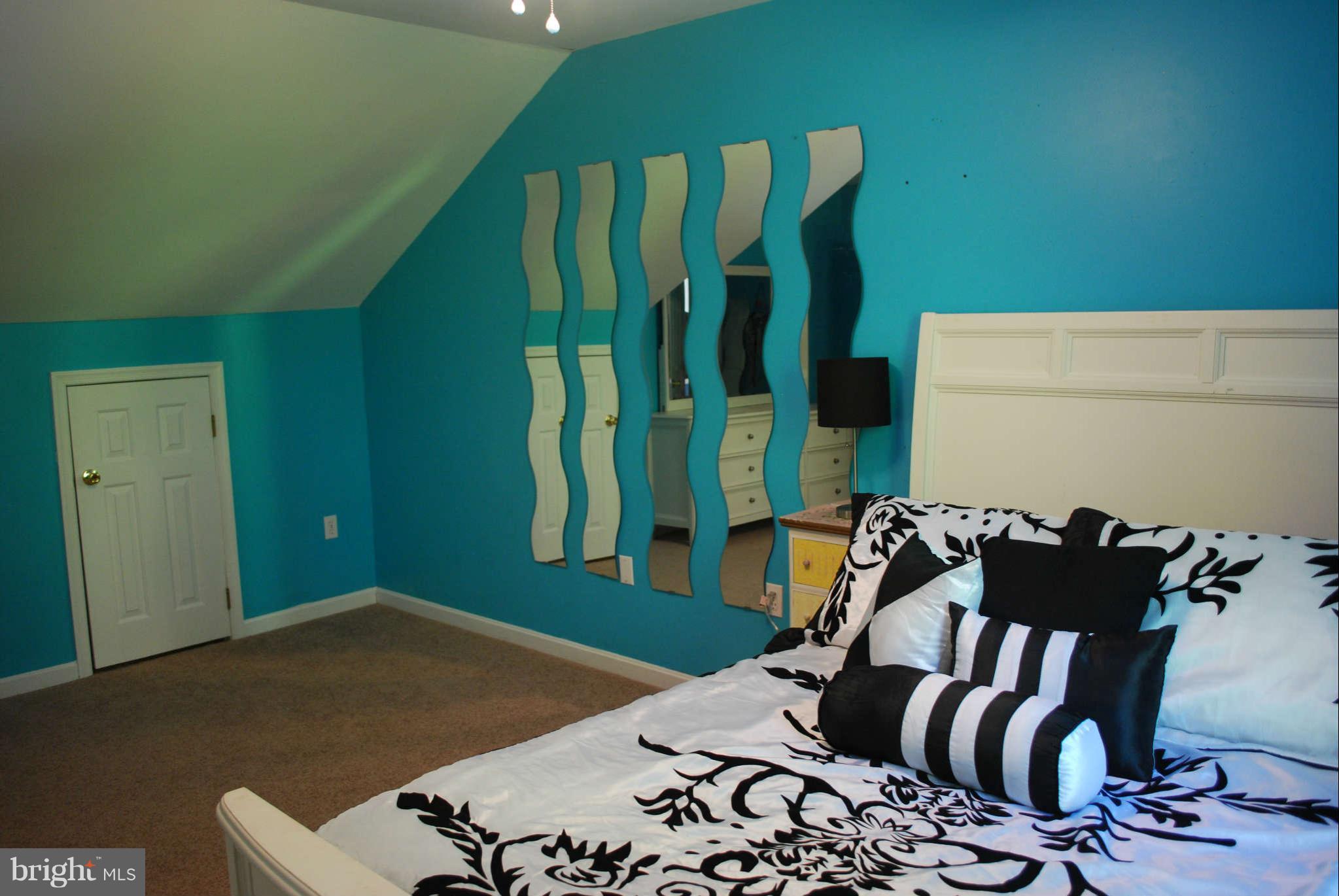 441 Rachaels Way Prince Frederick, MD 20678 - Photo 20 of 30 a bedroom with a bed and a chair