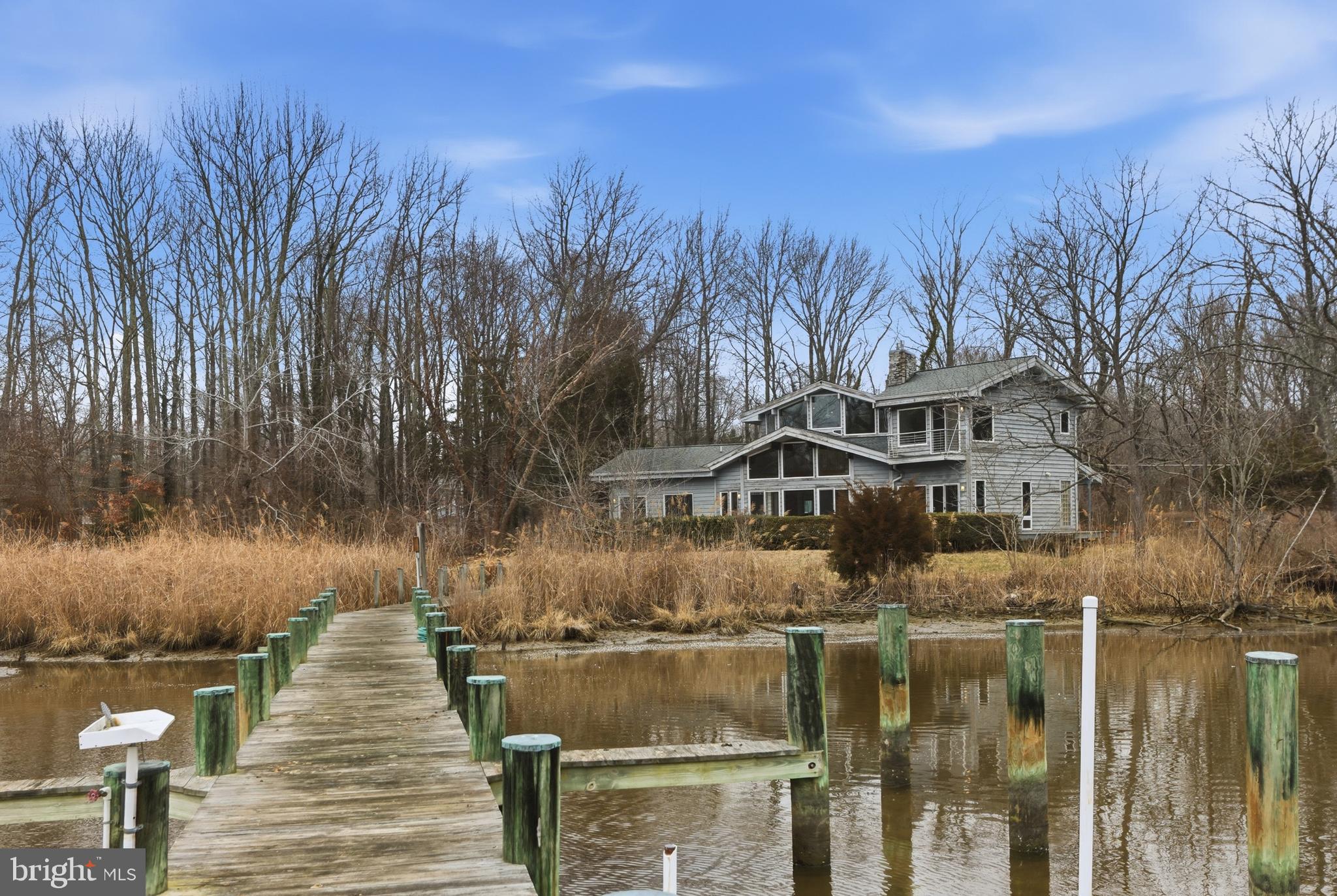a front view of a house with a lake view