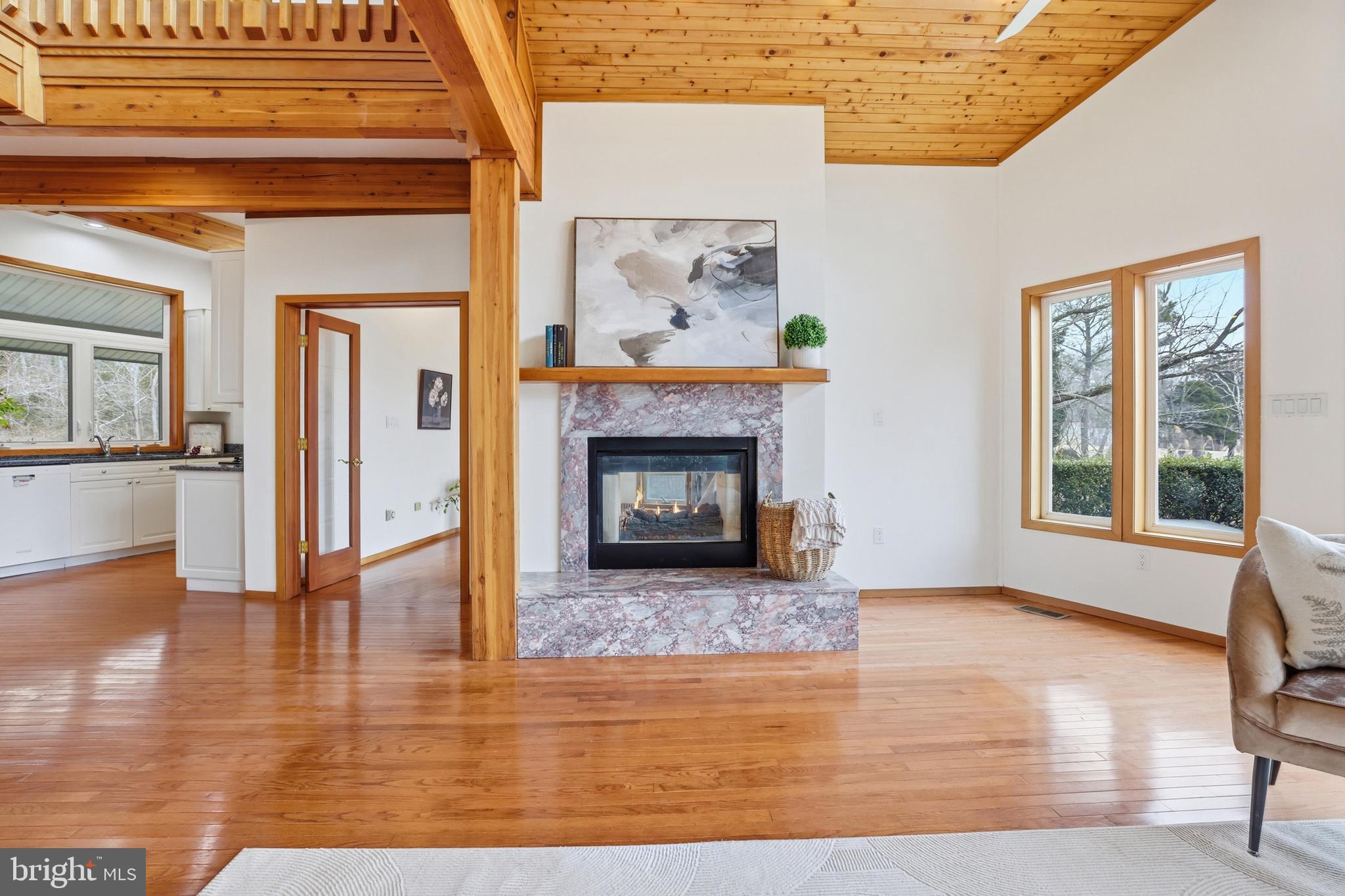 5931 Tyler Road Deale, MD 20751 - Photo 14 of 77 a view of a livingroom with wooden floor and a fireplace