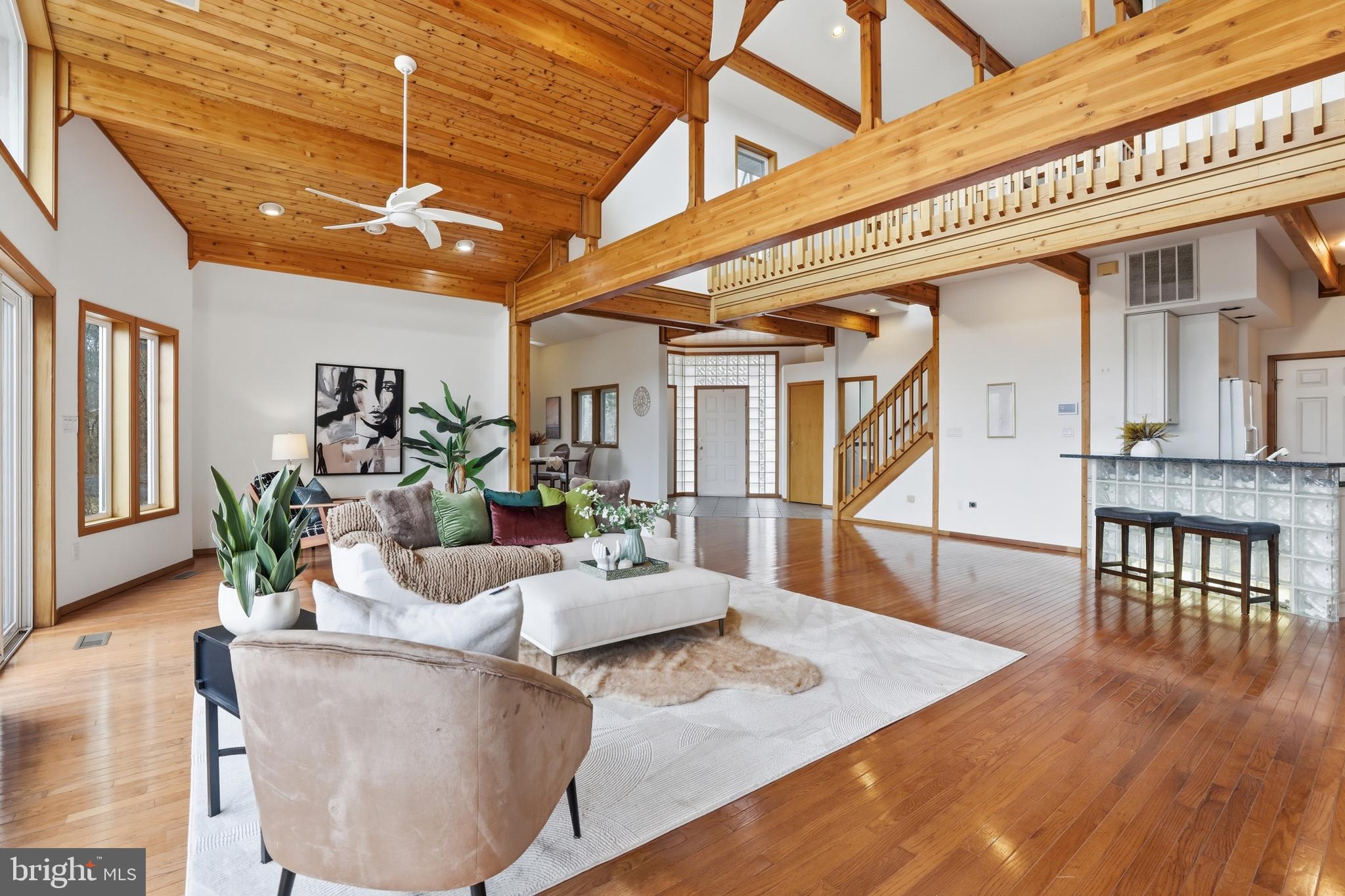 5931 Tyler Road Deale, MD 20751 - Photo 15 of 77 a living room with furniture and a wooden floor