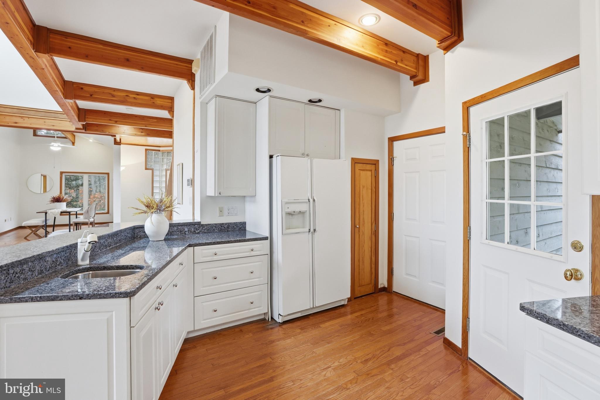 5931 Tyler Road Deale, MD 20751 - Photo 20 of 77 a bathroom with a granite countertop sink and a mirror