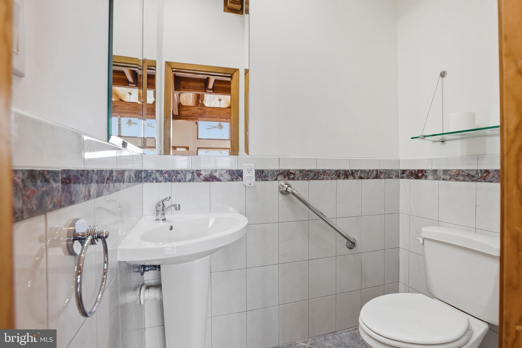 5931 Tyler Road Deale, MD 20751 - Photo 30 of 77 a bathroom with a sink and toilet