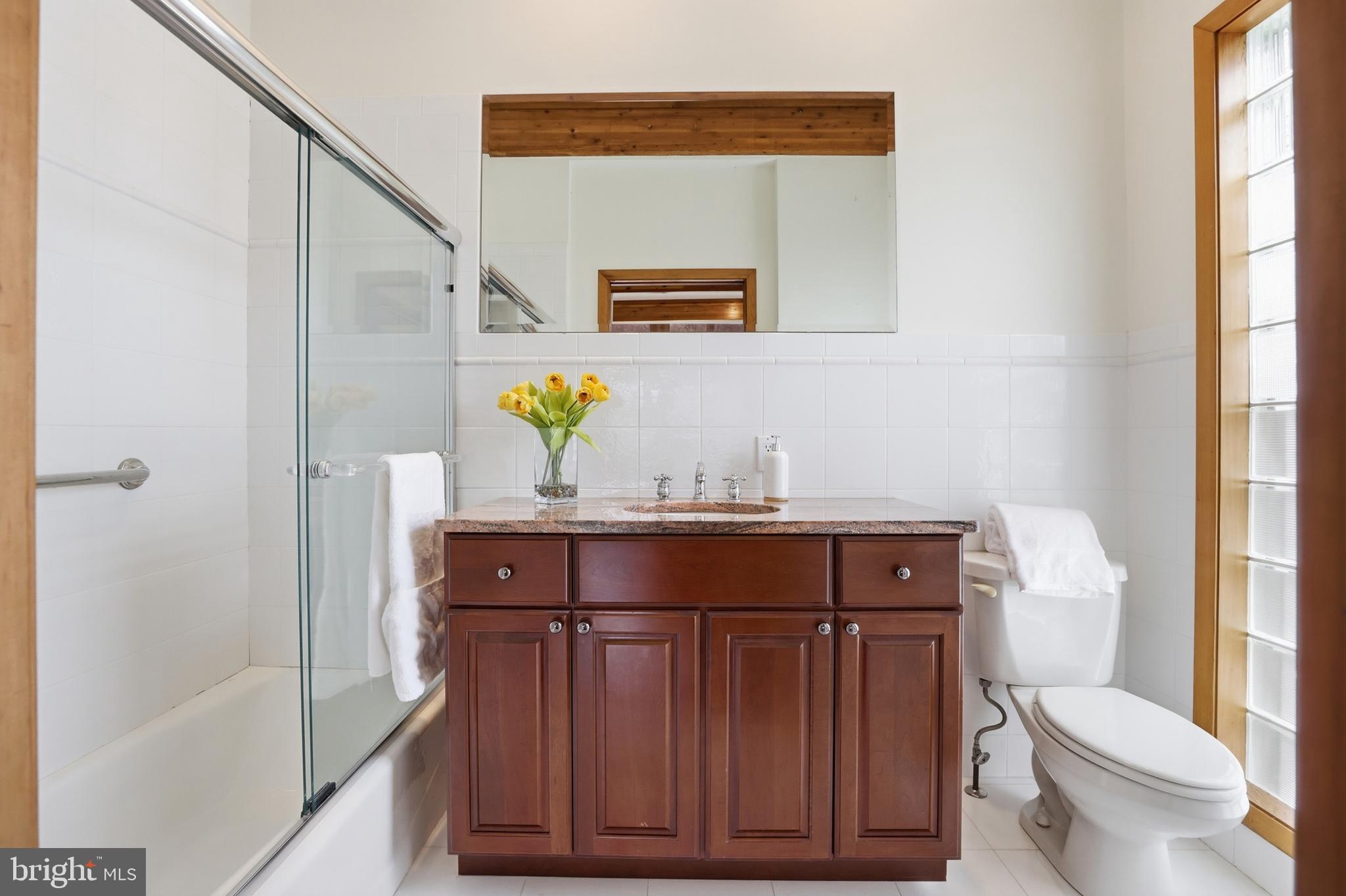 5931 Tyler Road Deale, MD 20751 - Photo 39 of 77 a bathroom with a sink a toilet and shower