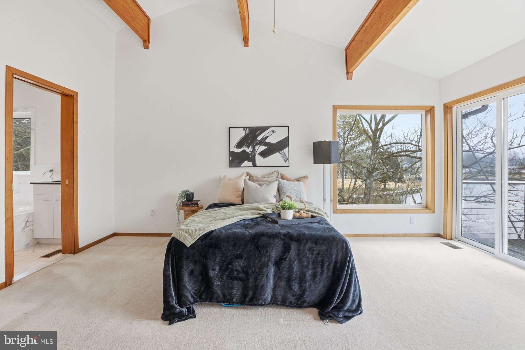 5931 Tyler Road Deale, MD 20751 - Photo 48 of 77 a bedroom with a bed and a large window