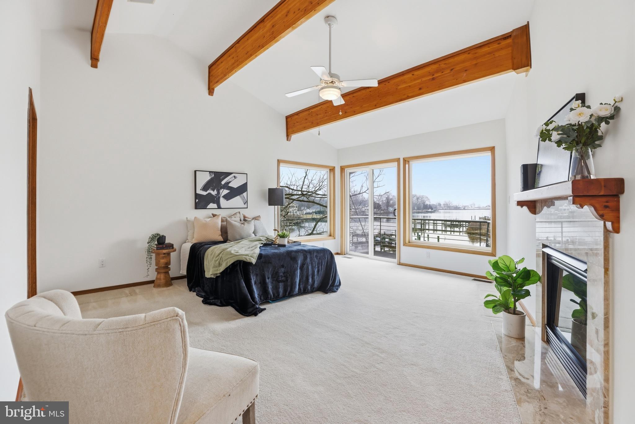 5931 Tyler Road Deale, MD 20751 - Photo 49 of 77 a spacious bedroom with a bed and a couch