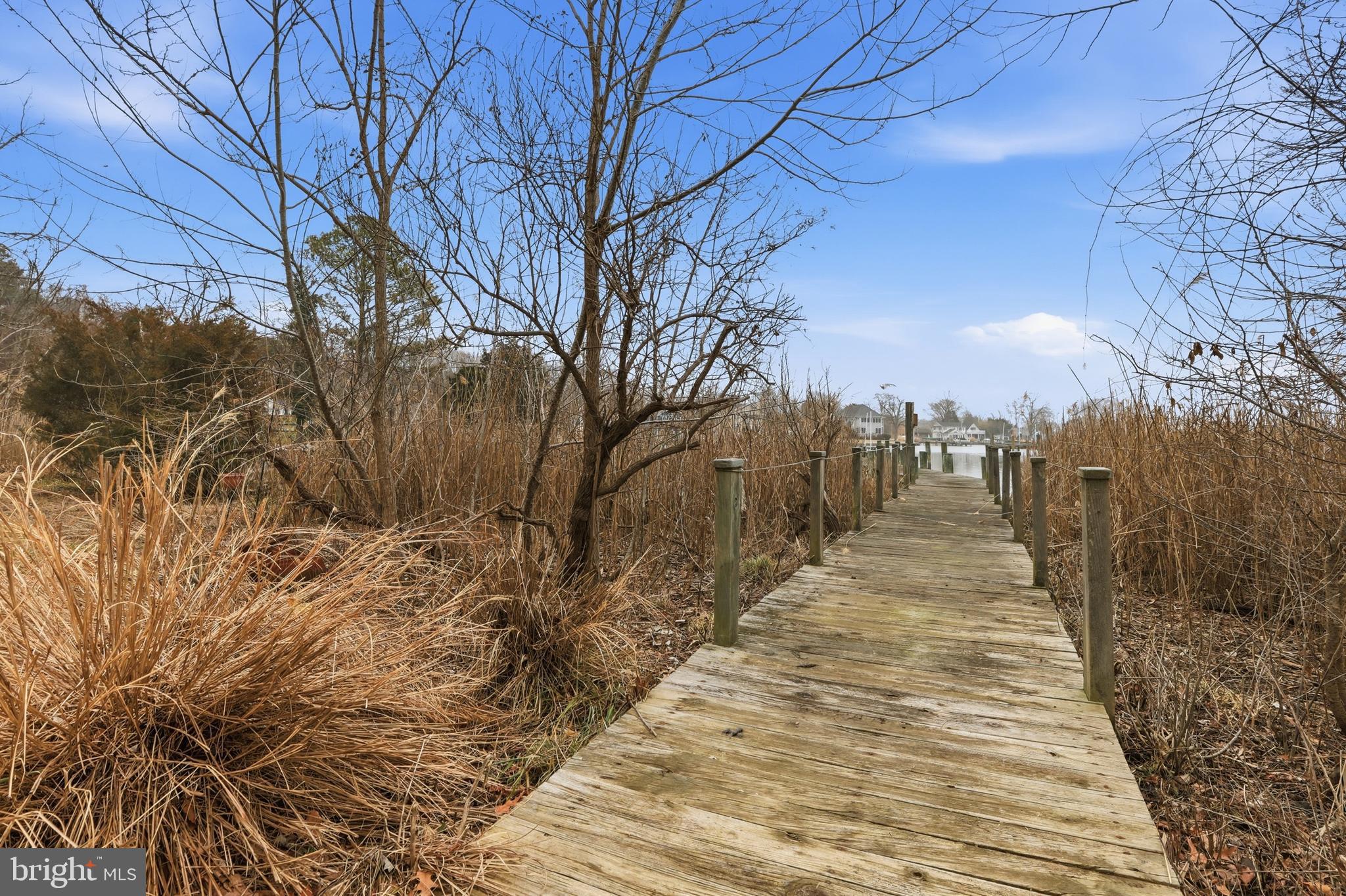 5931 Tyler Road Deale, MD 20751 - Photo 61 of 77 a view of a pathway with a wrought fence