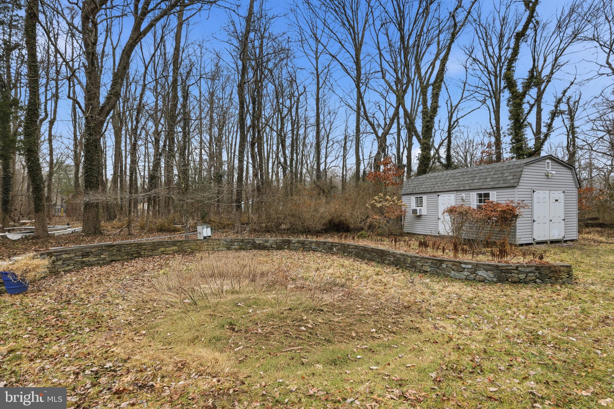 5931 Tyler Road Deale, MD 20751 - Photo 10 of 77 a view of a yard with a tree