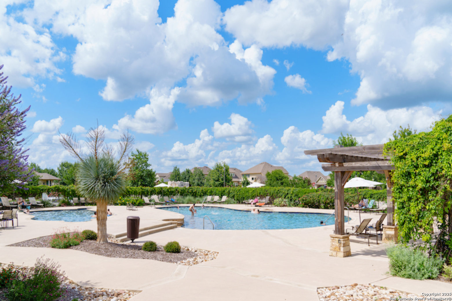 8123 Wellstone Schertz, TX 78154 - Photo 15 of 16 a park view with swimming pool and outdoor seating